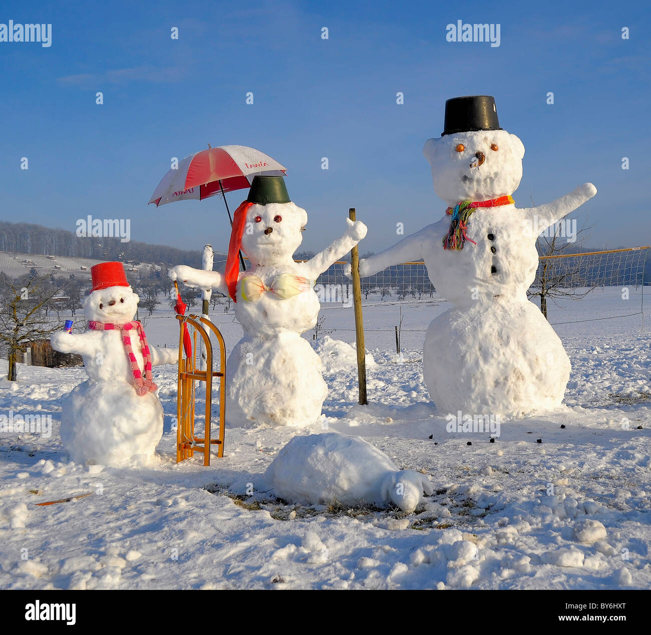 Snowman Family with animal figures, winter landscape, snowman family, Schneemannfamilie mit Tierfiguren, Winterlandschaft, Stock Photo