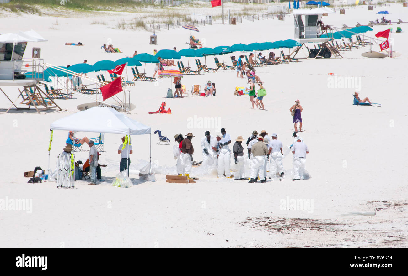 BP oil workers on Pensacola Beach at height of tourist season Stock