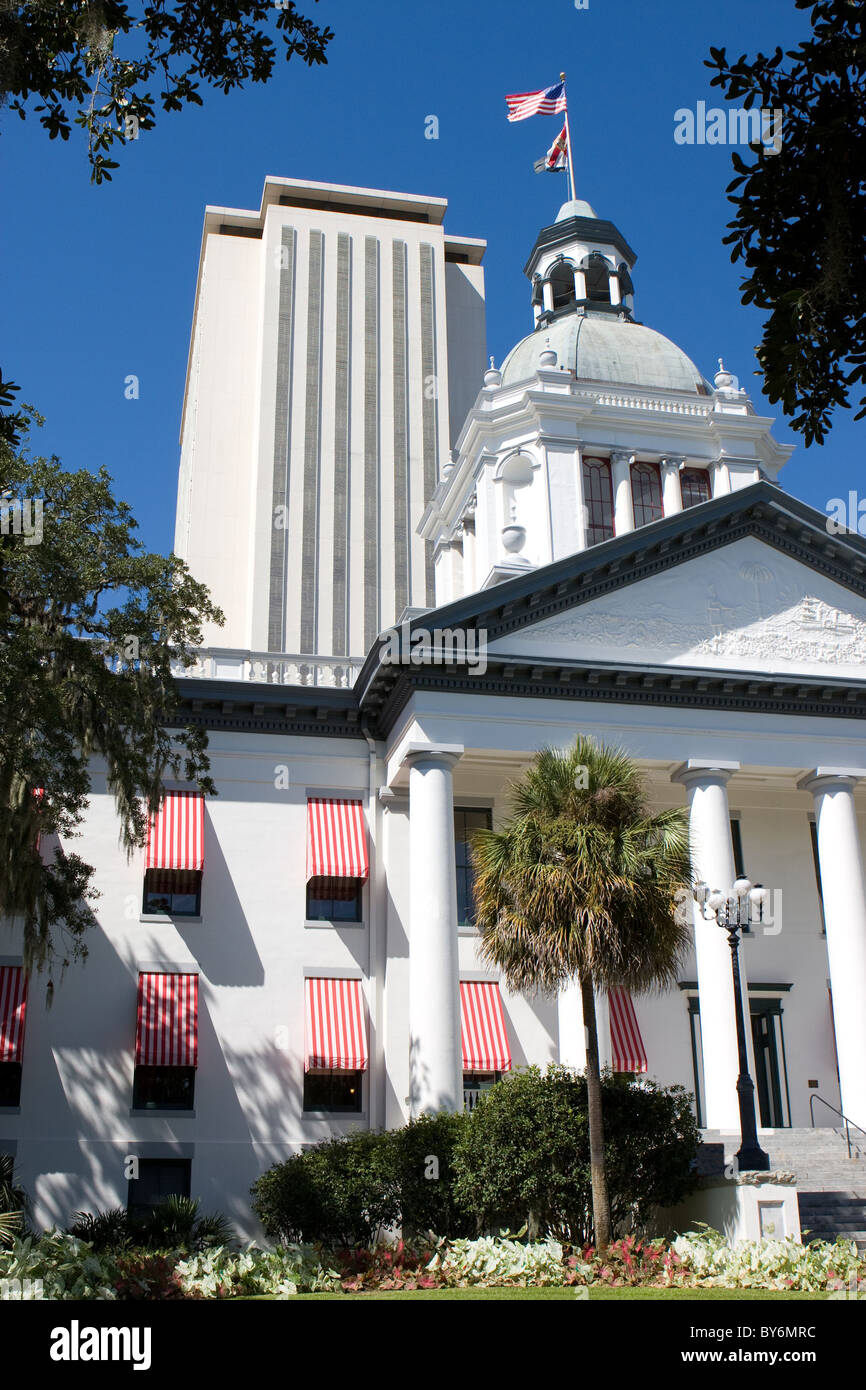 The old Florida State Capital building in Tallahassee sits in front of the new modern capital building which can be seen rising Stock Photo