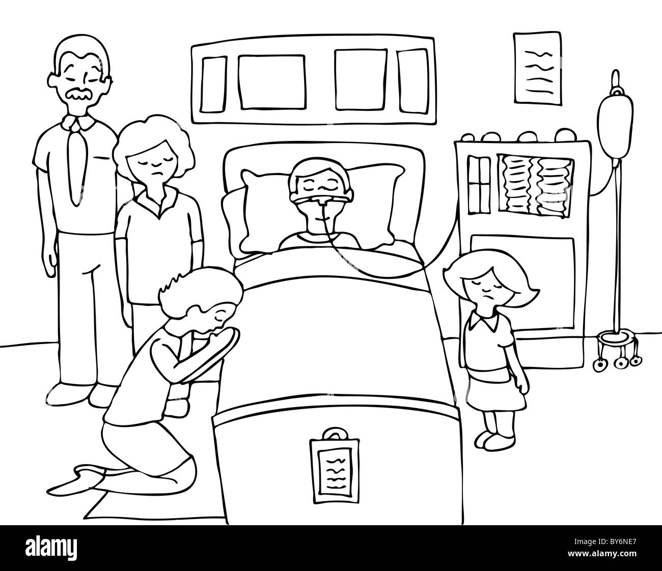 Sick child lays in a hospital bed with his family praying for his recovery - black and white Stock Photo