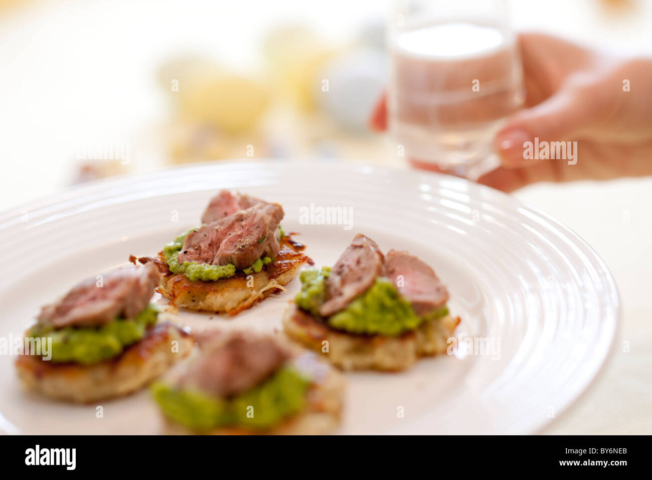 A plate of Lamb & Pea Canapes. Stock Photo