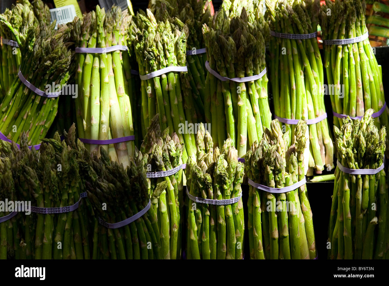 Asparagus bundles for sale at market, healthy vegetable food Stock Photo