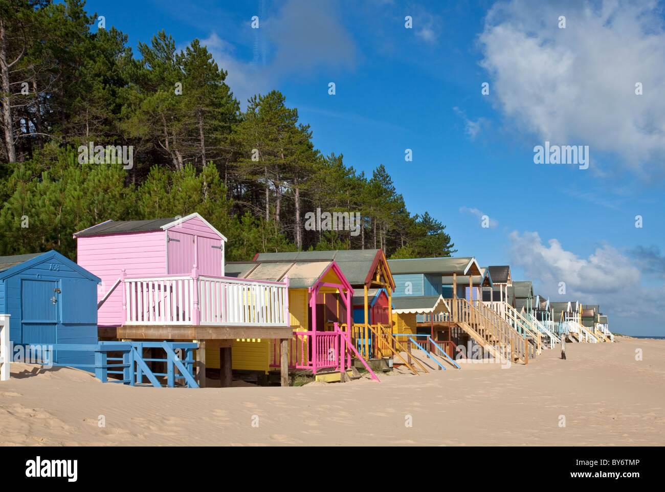 Colourful beach huts at Wells Next The Sea on the North Norfolk Coast on a summers morning Stock Colourful beach huts at Wells Next The Sea on the North Norfolk Coast on a summers morning Stock