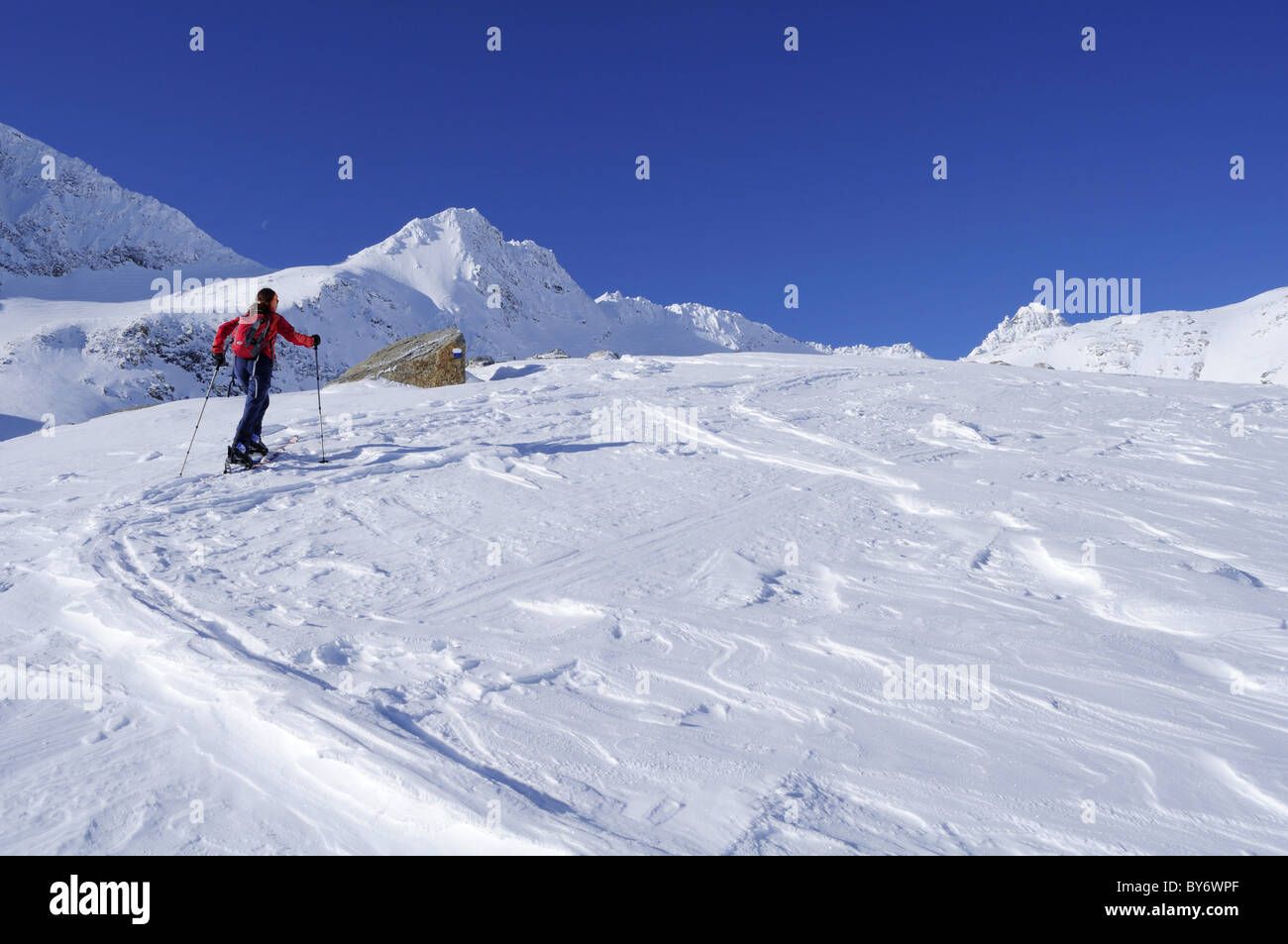 Female backcountry skier ascending to Hoher Sonnblick, Rauris valley, Goldberg mountain range, Hohe Tauern, Salzburg, Austria Stock Photo