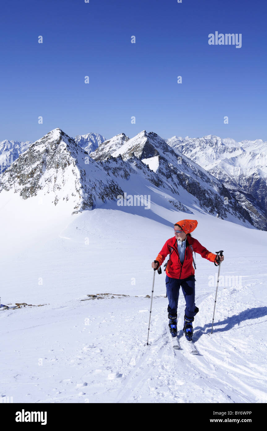 Female backcountry skier ascending to hut Zittelhaus, Hoher Sonnblick, Rauris valley, Goldberg mountain range, Hohe Tauern, Salz Stock Photo