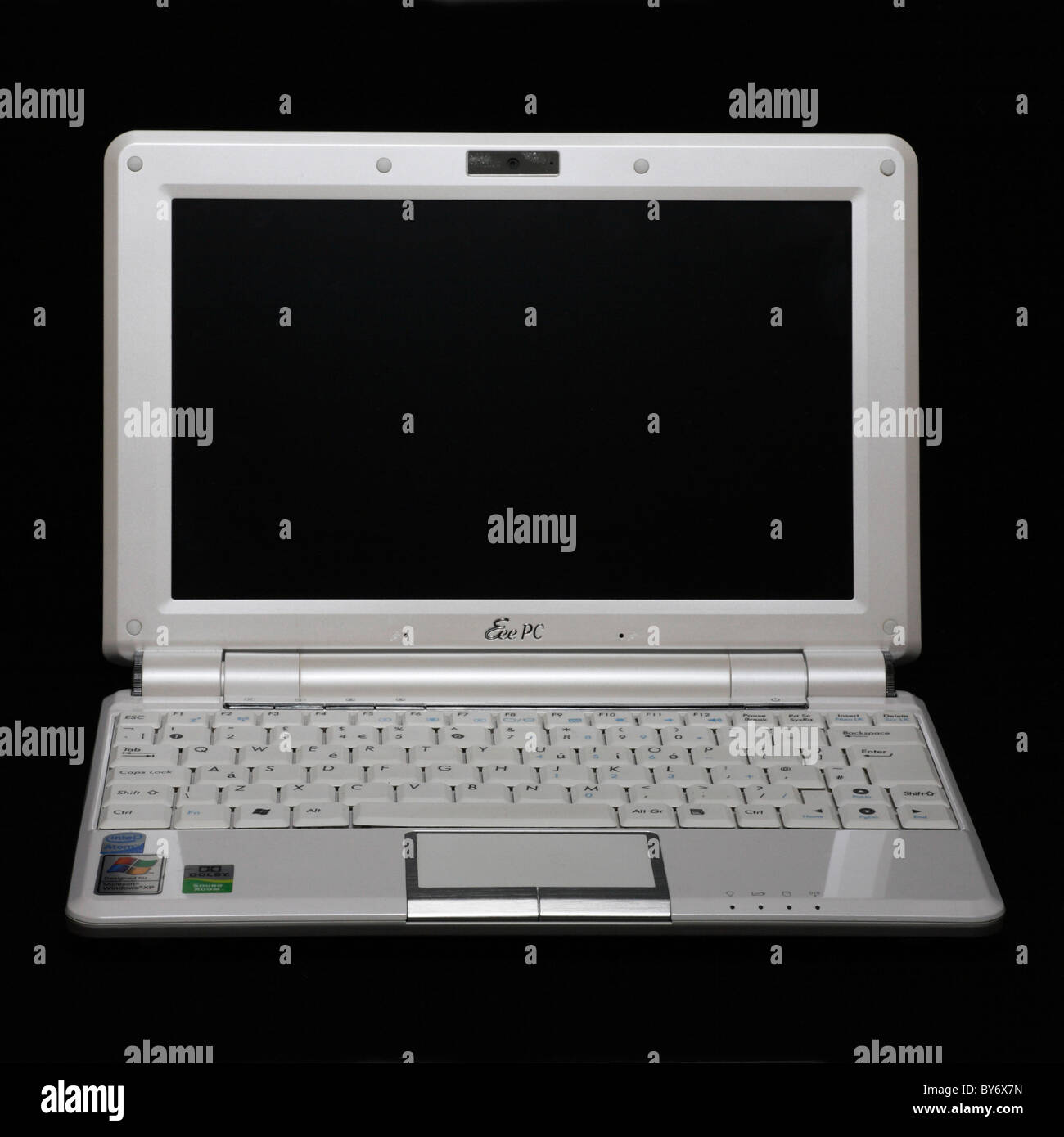 White Asus Eeepc 10 inch screen windows netbook mini laptop computer PC isolated on black Stock Photo