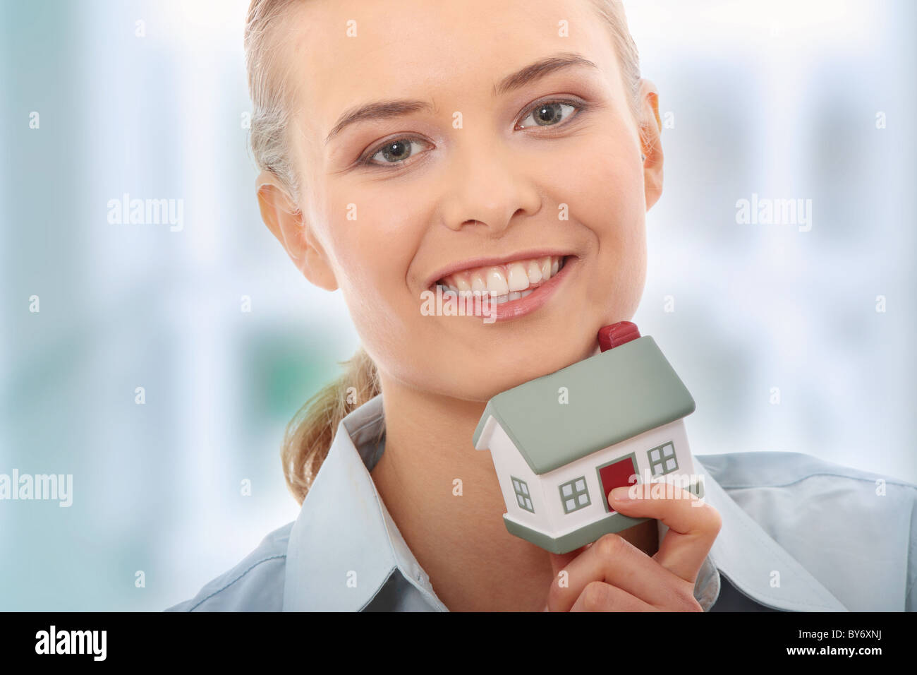 Young beautiful business woman with house model - real estate Stock ...