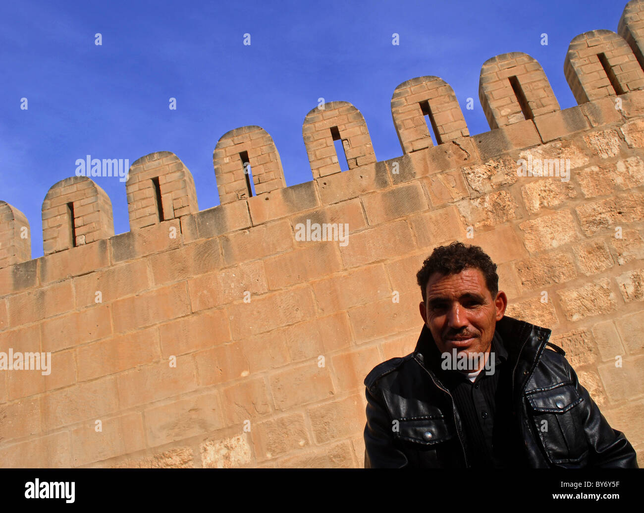 Portrait of a man outside the great mosque in Sousse, Tunisia Stock Photo