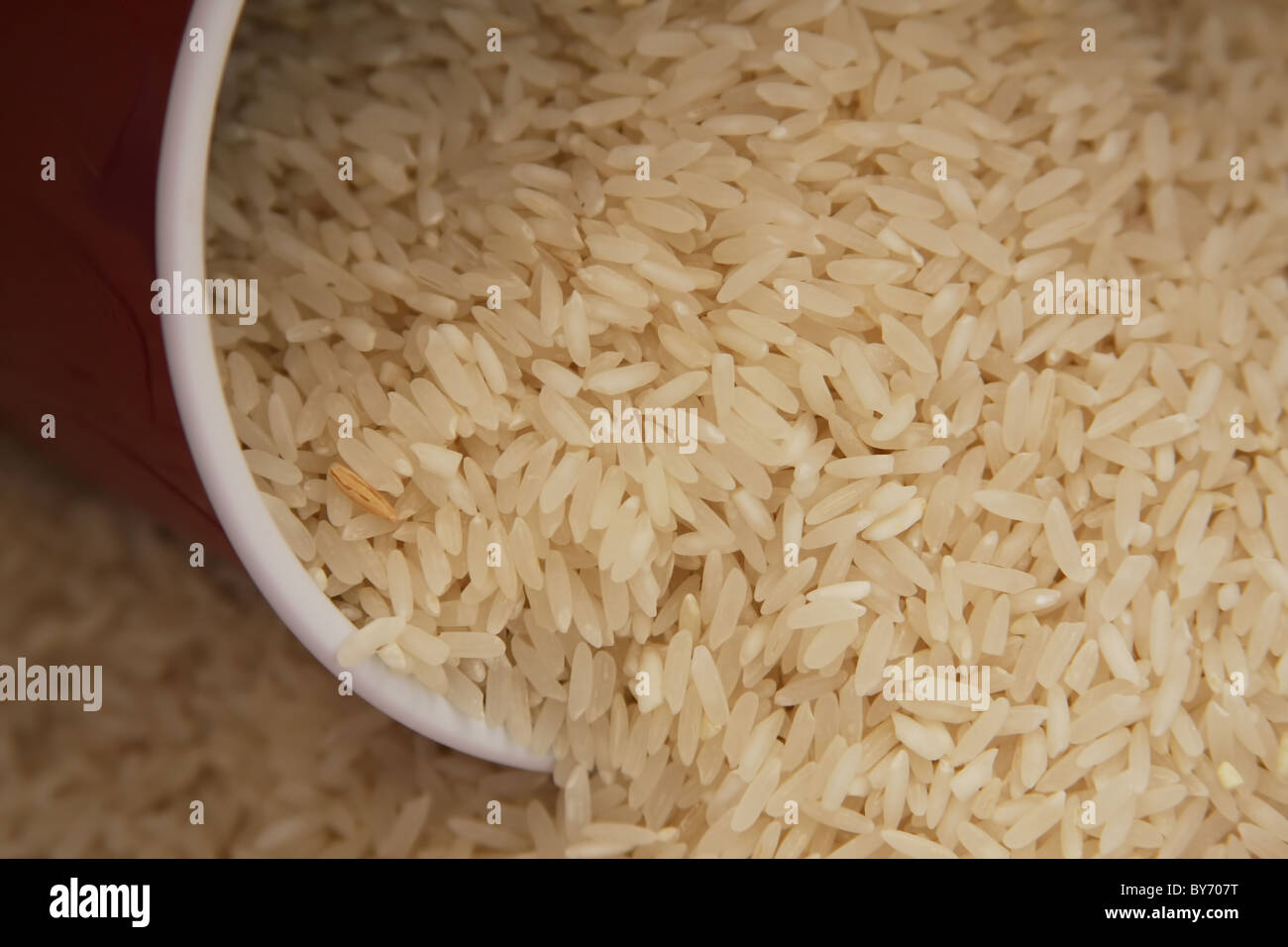 Uncooked White Rice Pouring Out Of A Cup Stock Photo Alamy Uncooked White Rice Pouring Out Of A Cup Stock Photo Alamy