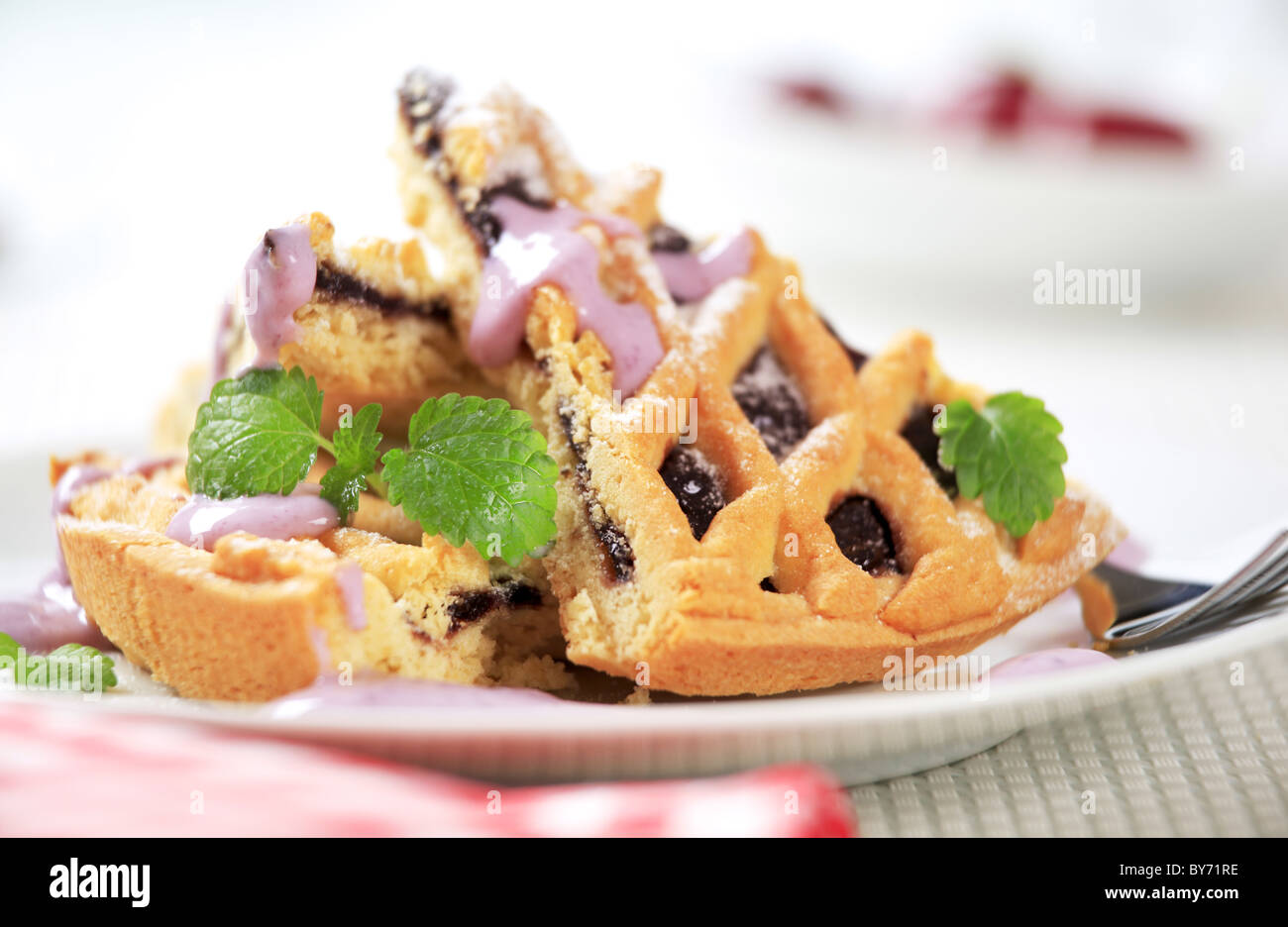 Slices of lattice topped jam tart Stock Photo