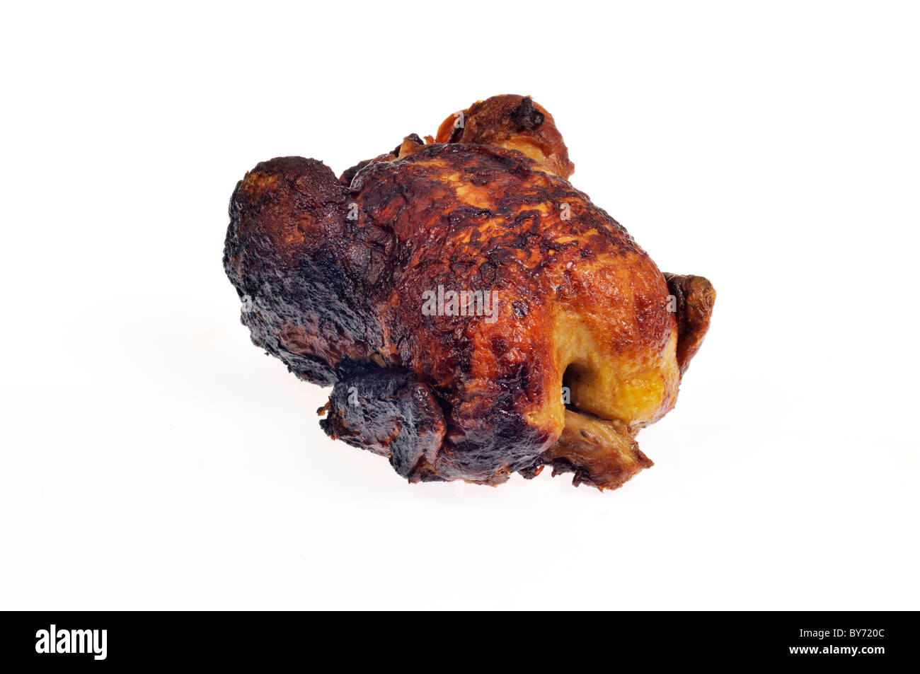 Hot cooked whole Rotisserie roasted chicken on white background, cutout. Stock Photo
