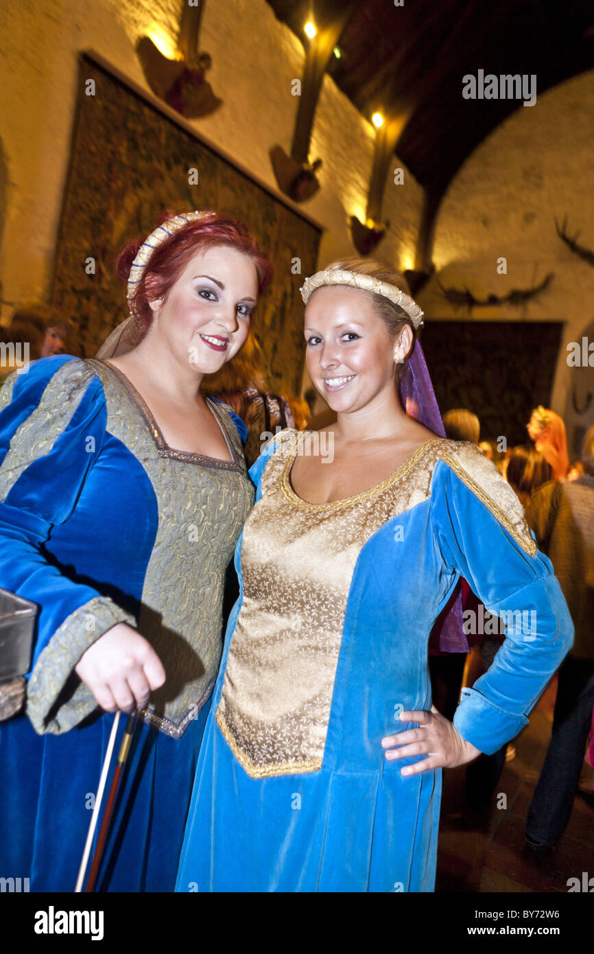 Young women perform at Bunratty Castle Medieval Banquet, County Clare, Ireland Stock Photo