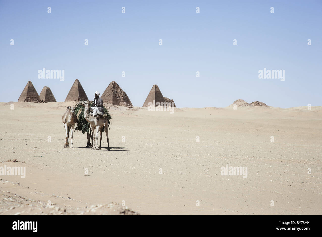 Camel rider in front of pyramids of Napata, Karima, Sudan, Africa Stock ...