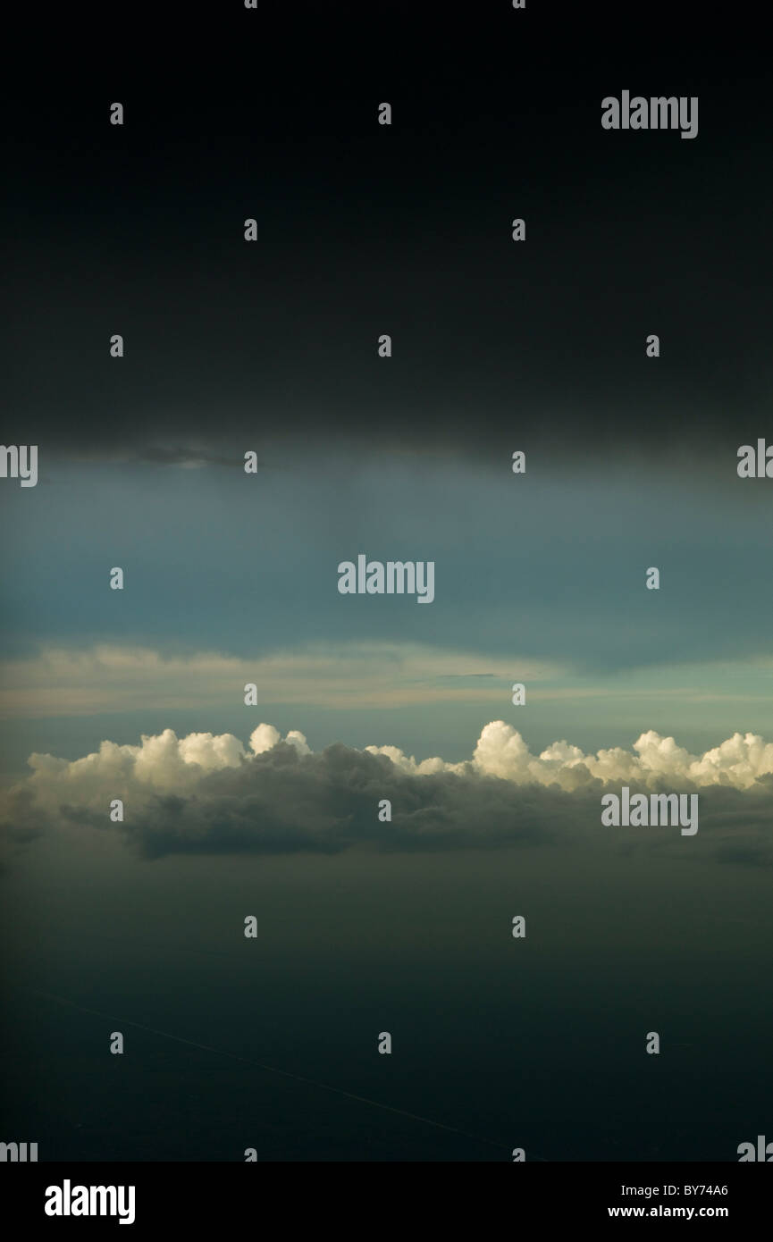 Clouds out of airliners window Stock Photo