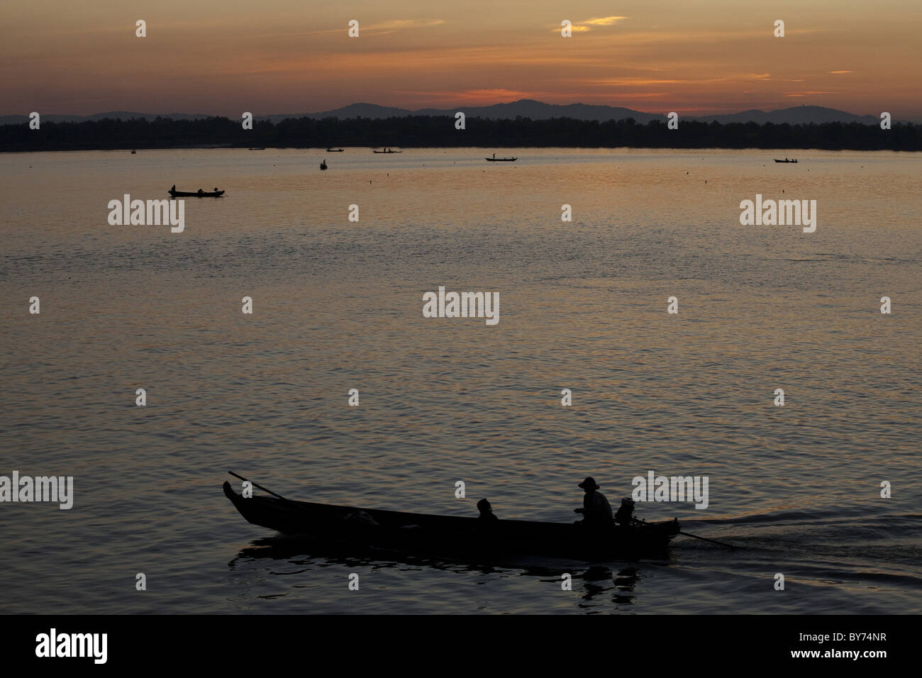 Fishing boats on the Thanlwin river at dusk, Mawlamyaing, Mon State, Myanmar, Birma, Asia Stock Photo