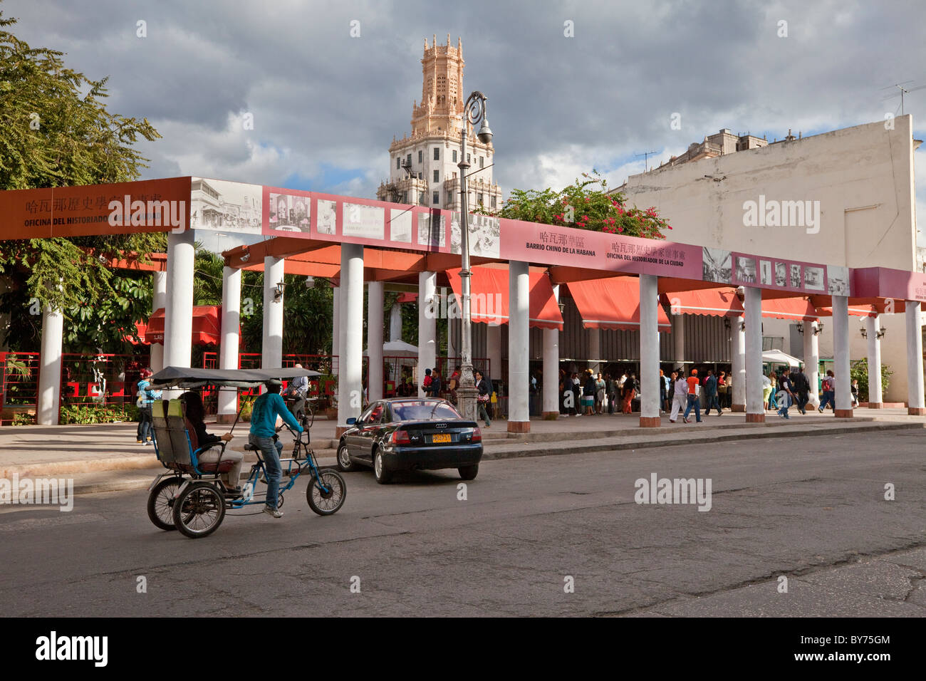Cuba, Havana. Entrance to Shopping Arcade in Havana's Chinatown District. Cuban Telecom Building in Center Background. Stock Photo