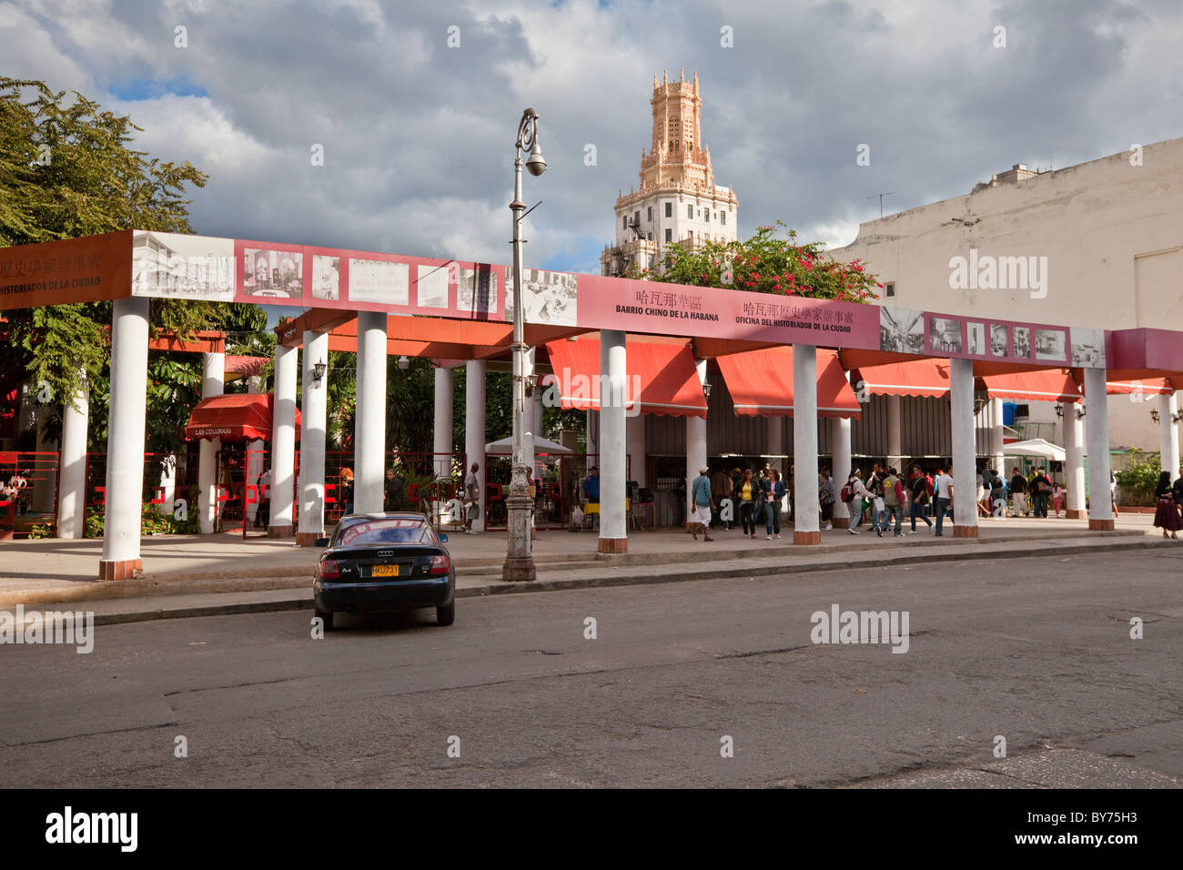Cuba, Havana. Entrance to Shopping Arcade in Havana's Chinatown District. Cuban Telecom Building in Center Background. Stock Photo