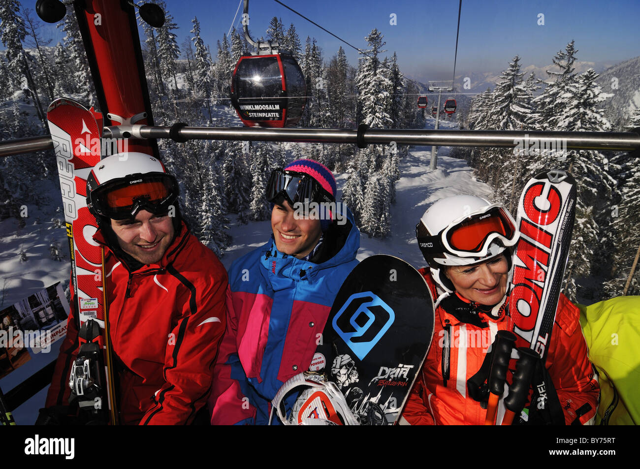 Skiers and snowboarder at cable car, Reit im Winkl, Chiemgau, Upper Bavaria, Bavaria, Germany, Europe Stock Photo
