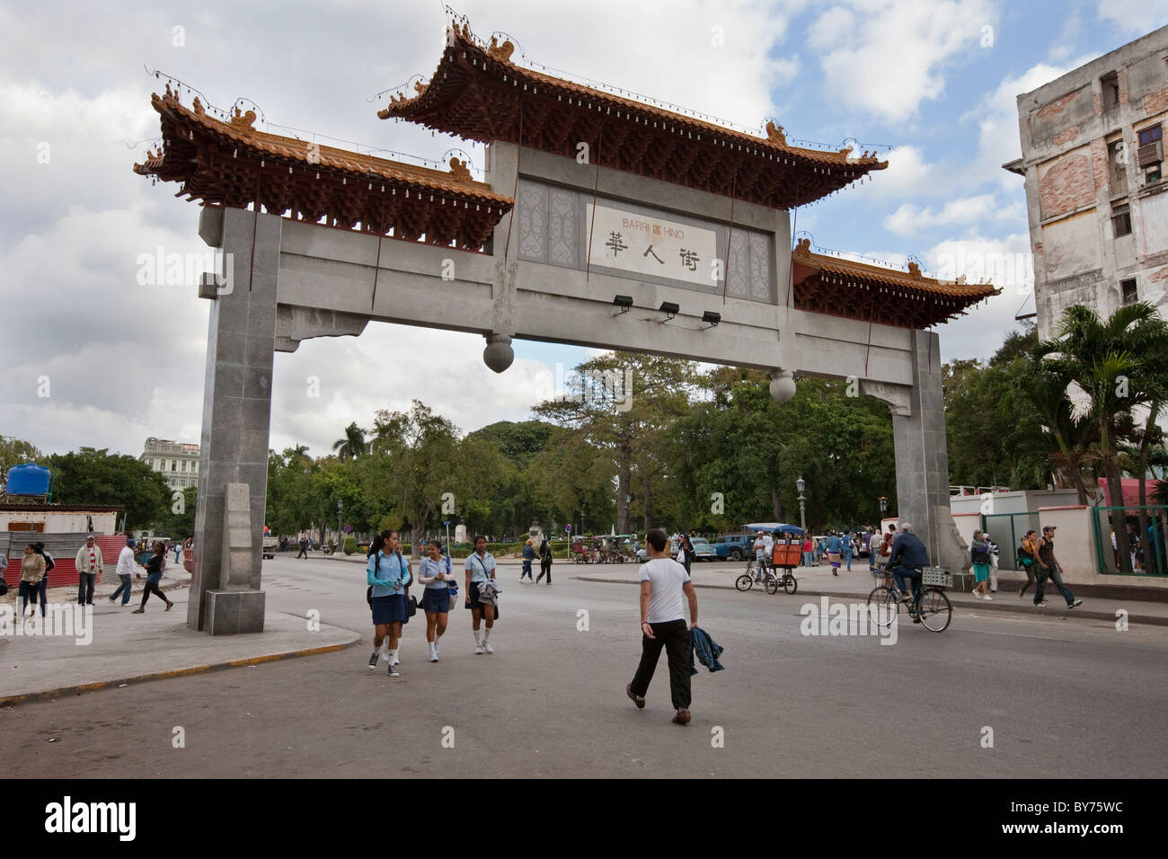 Cuba, Havana. Gate Marking Exit From China Town. Gift of the Republic of China. Schoolgirls in Uniform. Stock Photo