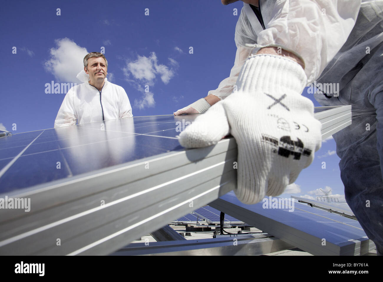 Technicians installing a photovoltaic power plant, Hamburg, Germany Stock Photo