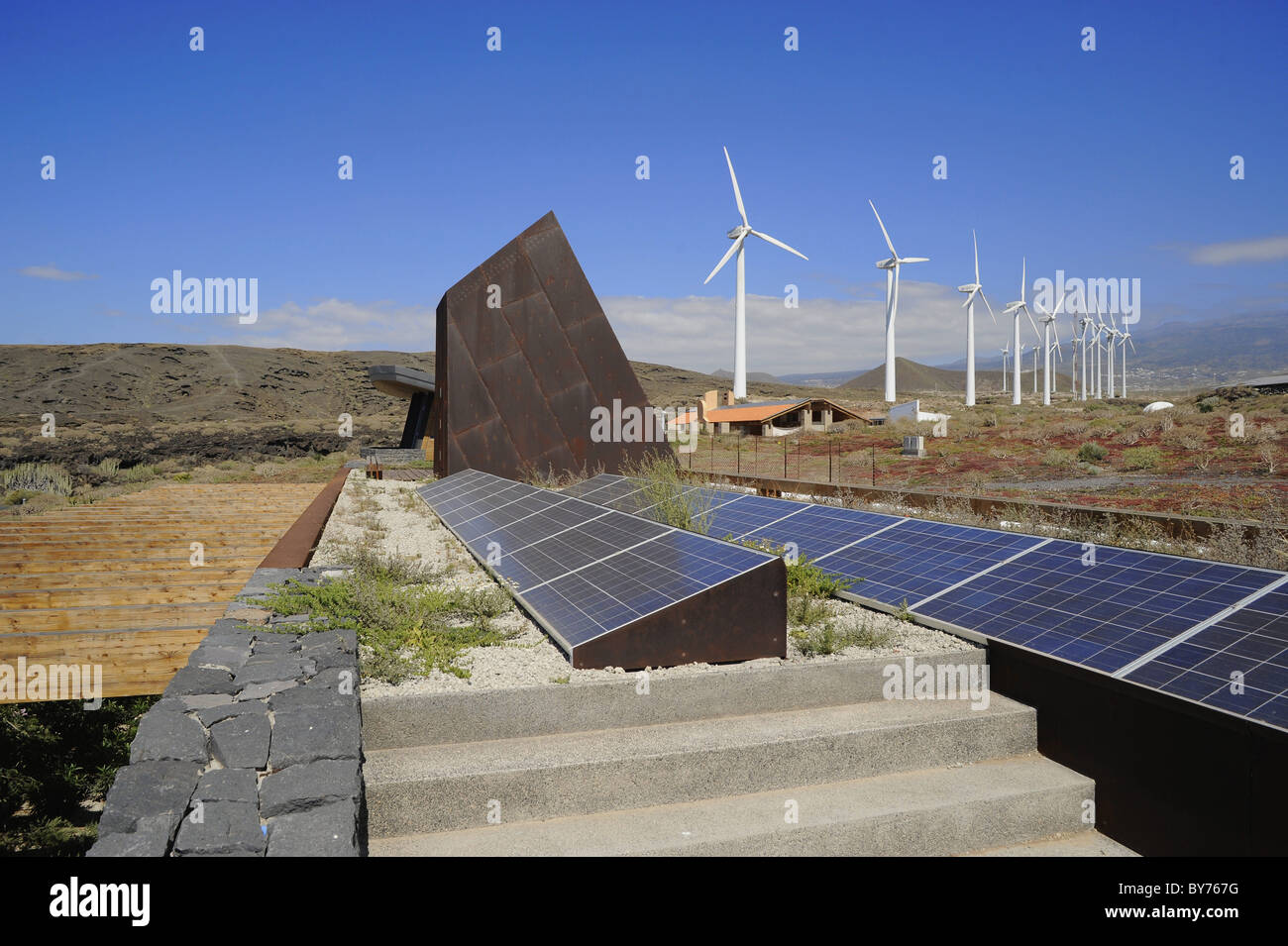 Windmills and solar collectors at ITER Eoparc, South Tenerife, Canary Islands, Spain Stock Photo