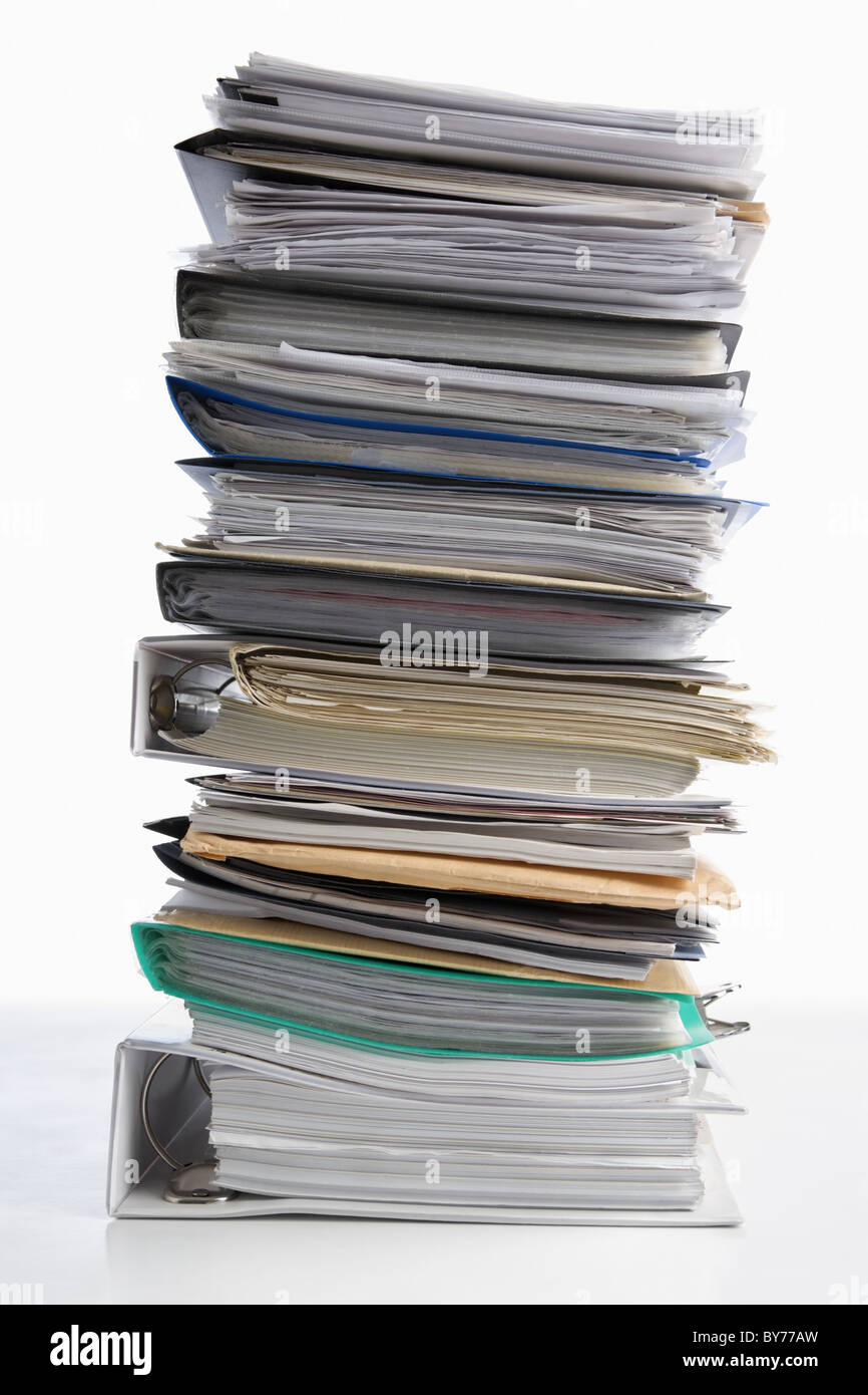 Pile of paper on white background. Workload concept Stock Photo - Alamy