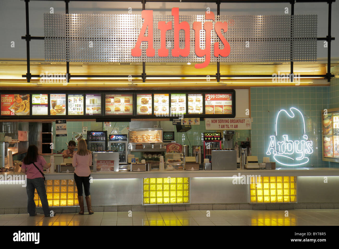 Atlanta Georgia,CNN Center,atrium fast food court plaza,Arby's,roast beef,counter,neon sign,woman customer,cashier,menu logo restaurant resstaurants Stock Photo