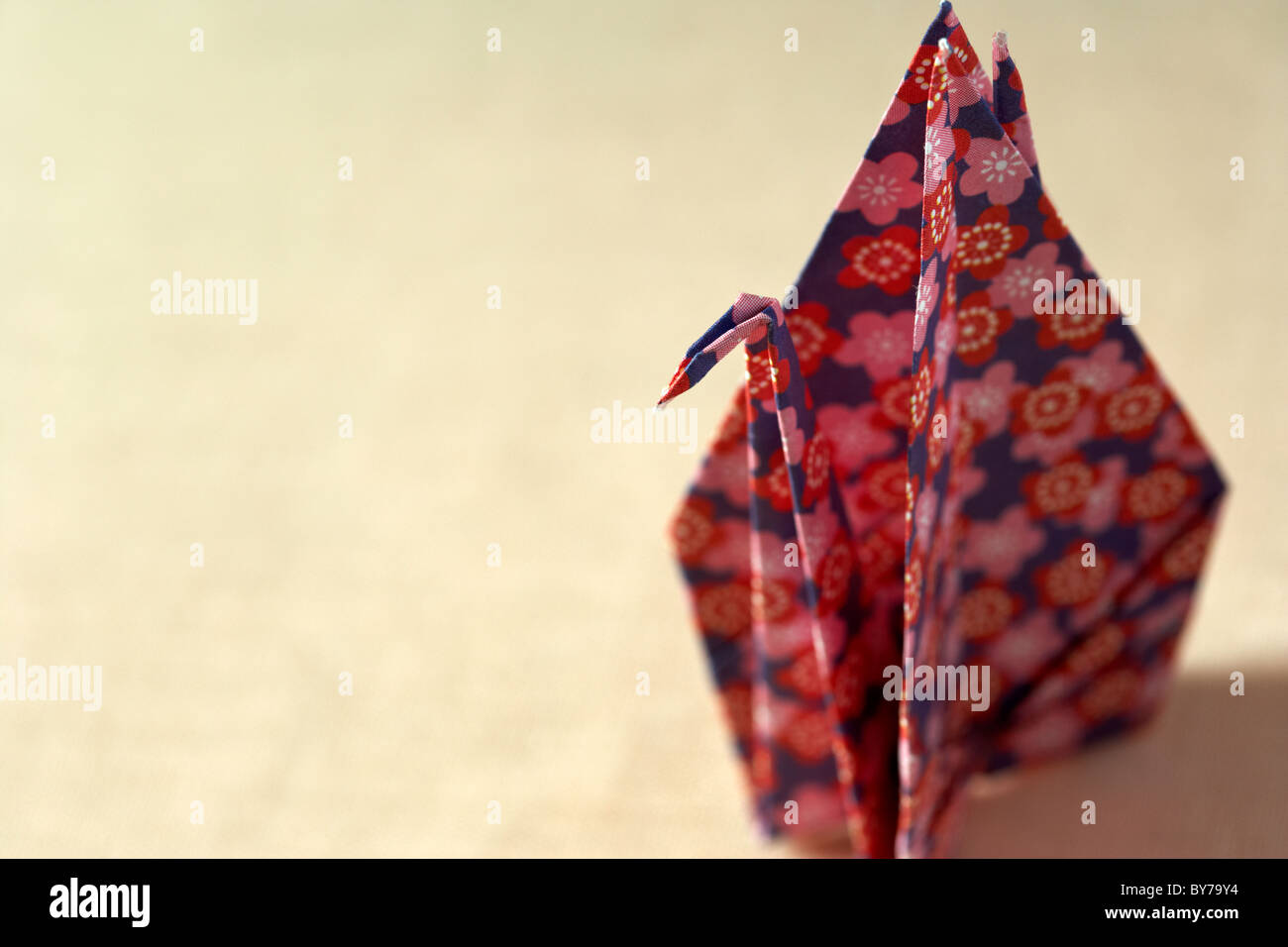 origami crane as prepared in japanese hotels resting on a pillow Stock Photo