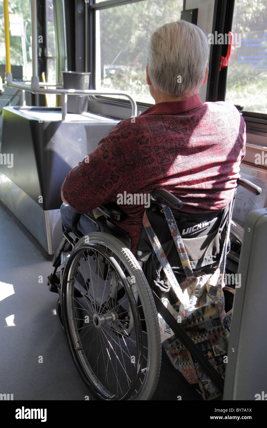 Atlanta Georgia,MARTA,bus,coach,man men male,passenger passengers rider riders,wheelchair,ADA,accessible,disabled handicapped special needs,GA10100904 Stock Photo