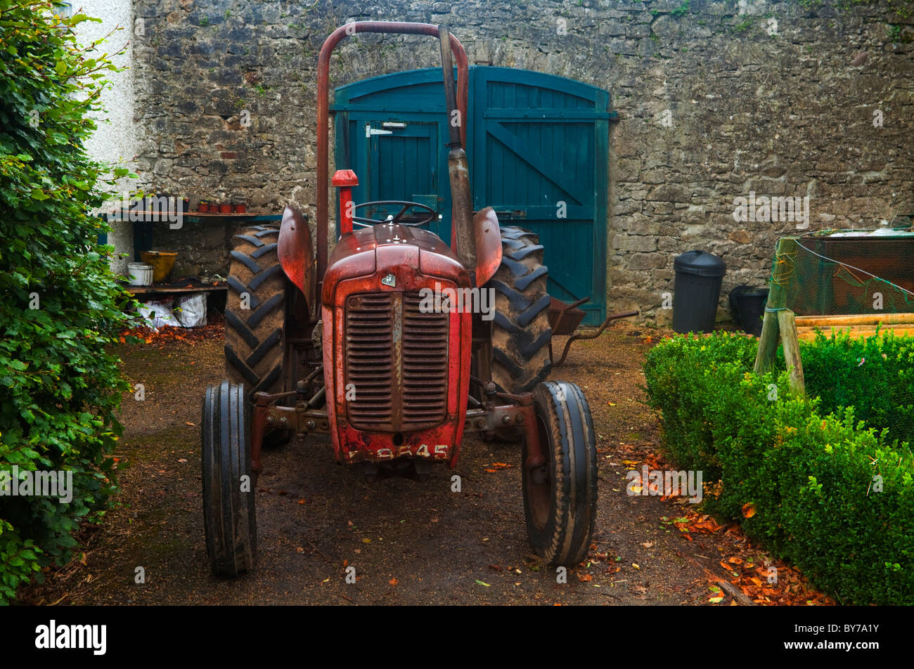 Vintage Tractor in the Walled Garden in Strokestown House Demesne, County Roscommon, Ireland Stock Photo