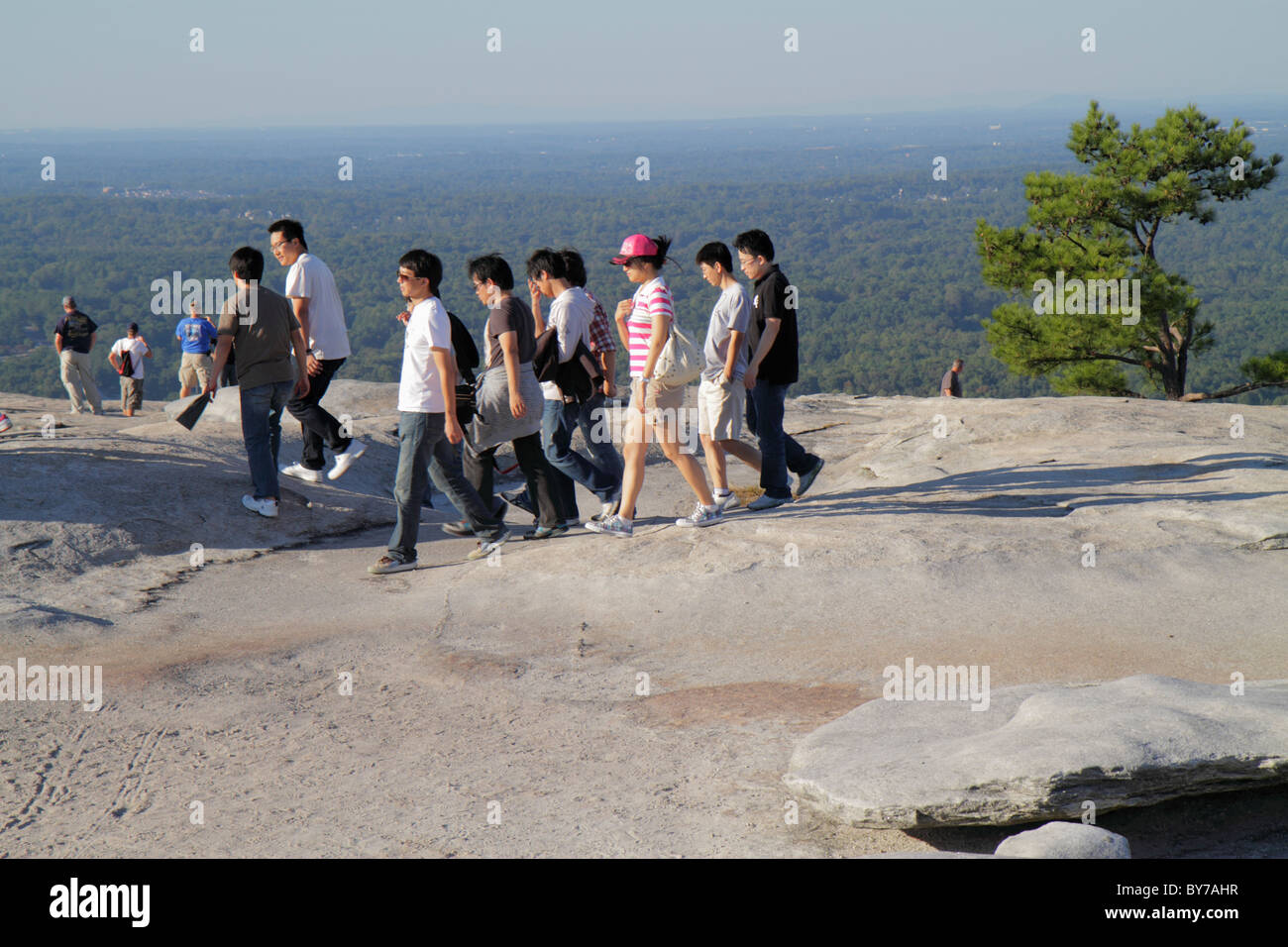 Atlanta Georgia,Stone Mountain Park,quartz monzonite,monadnock,geology,summit,rock,Asian man men male,woman female women,young adult,group,walk,hike,d Stock Photo