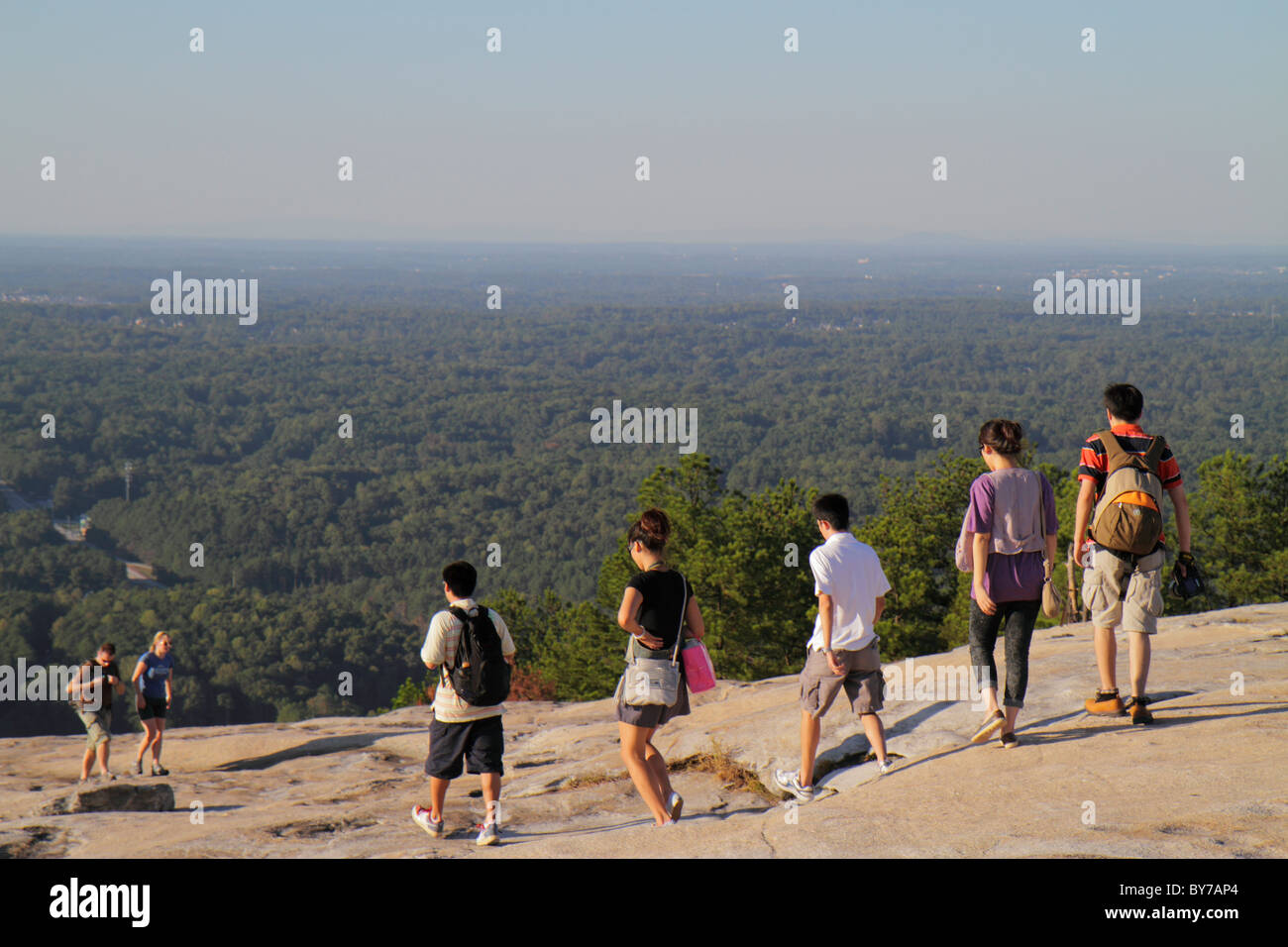 Atlanta Georgia,Stone Mountain Park,quartz monzonite,monadnock,geology,summit,rock,Asian man men male,woman female women,young adult,group,couple,walk Stock Photo