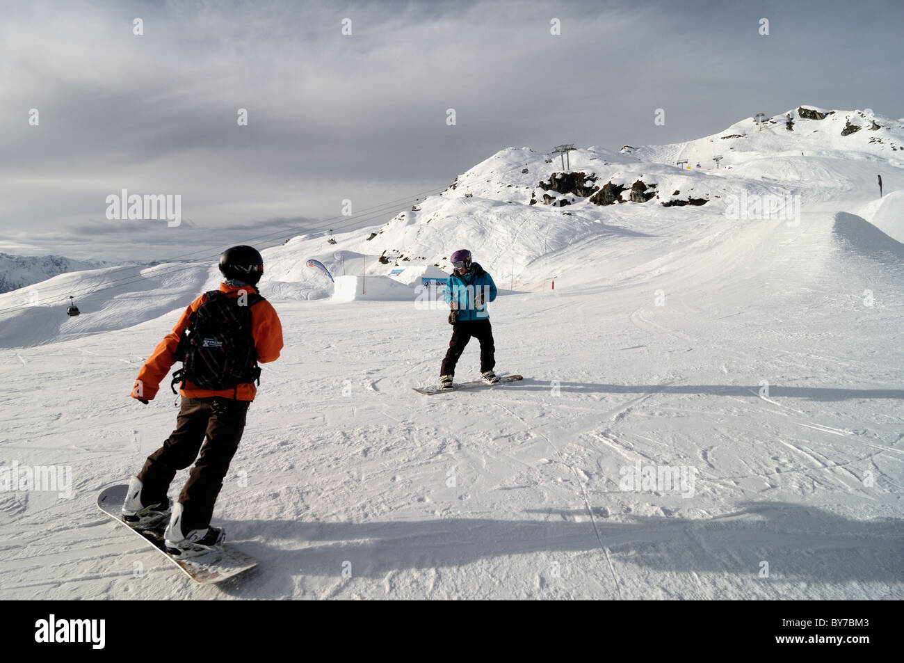 Two snow boarders in Verbier, Switzerland. Stock Photo