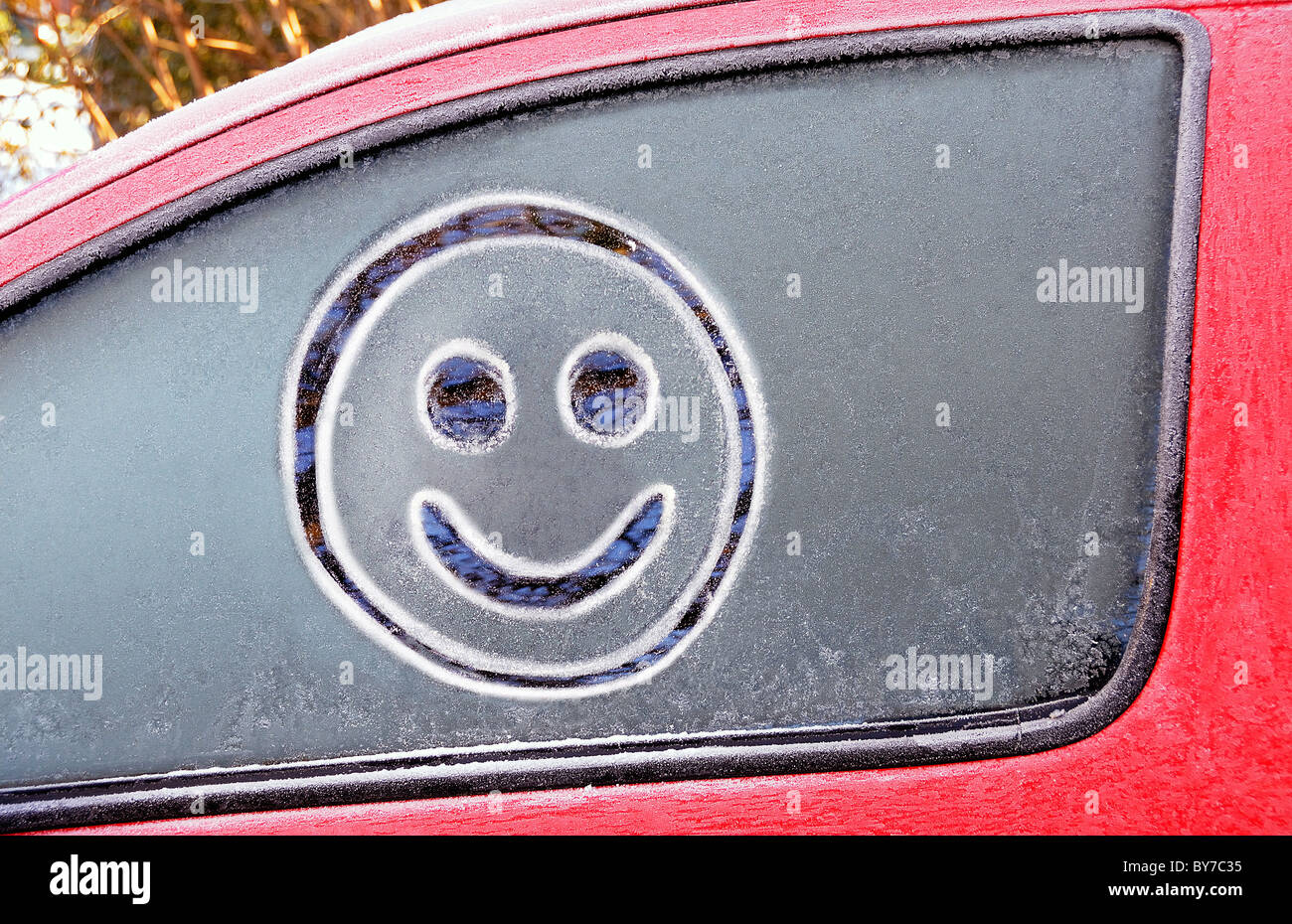 smiley face on car window Stock Photo - Alamy
