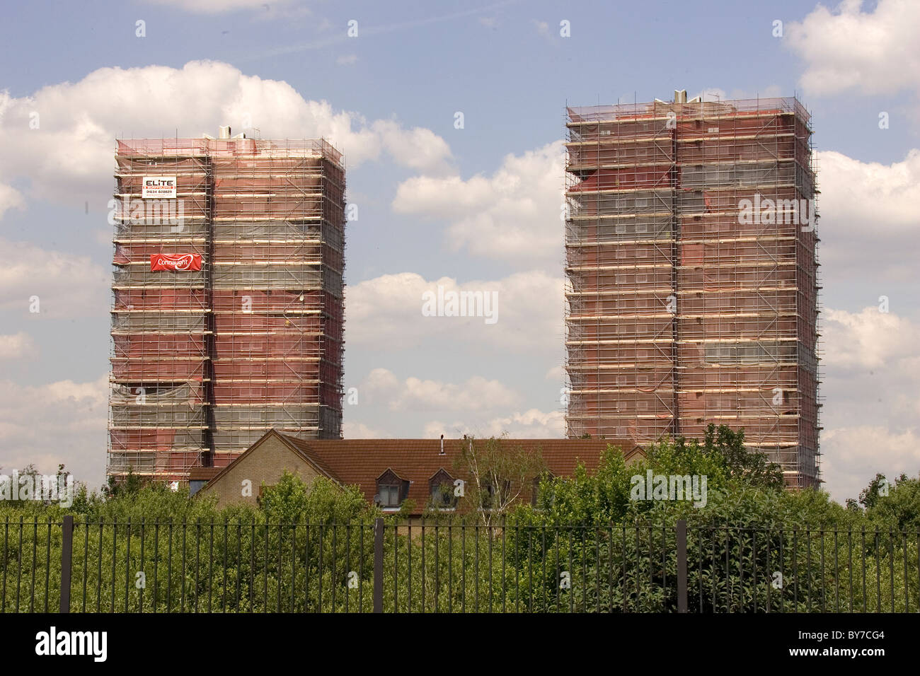 Two apartment blocks covered in scaffolding Stock Photo