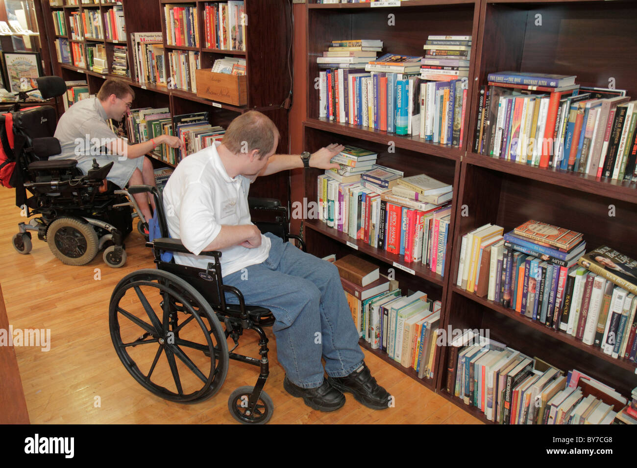 Georgia Gainesville,Main Street Market building,Next Chapter Book Store,bookstore,bookseller,used book,books,shelf shelves,man men male,disabled handi Stock Photo