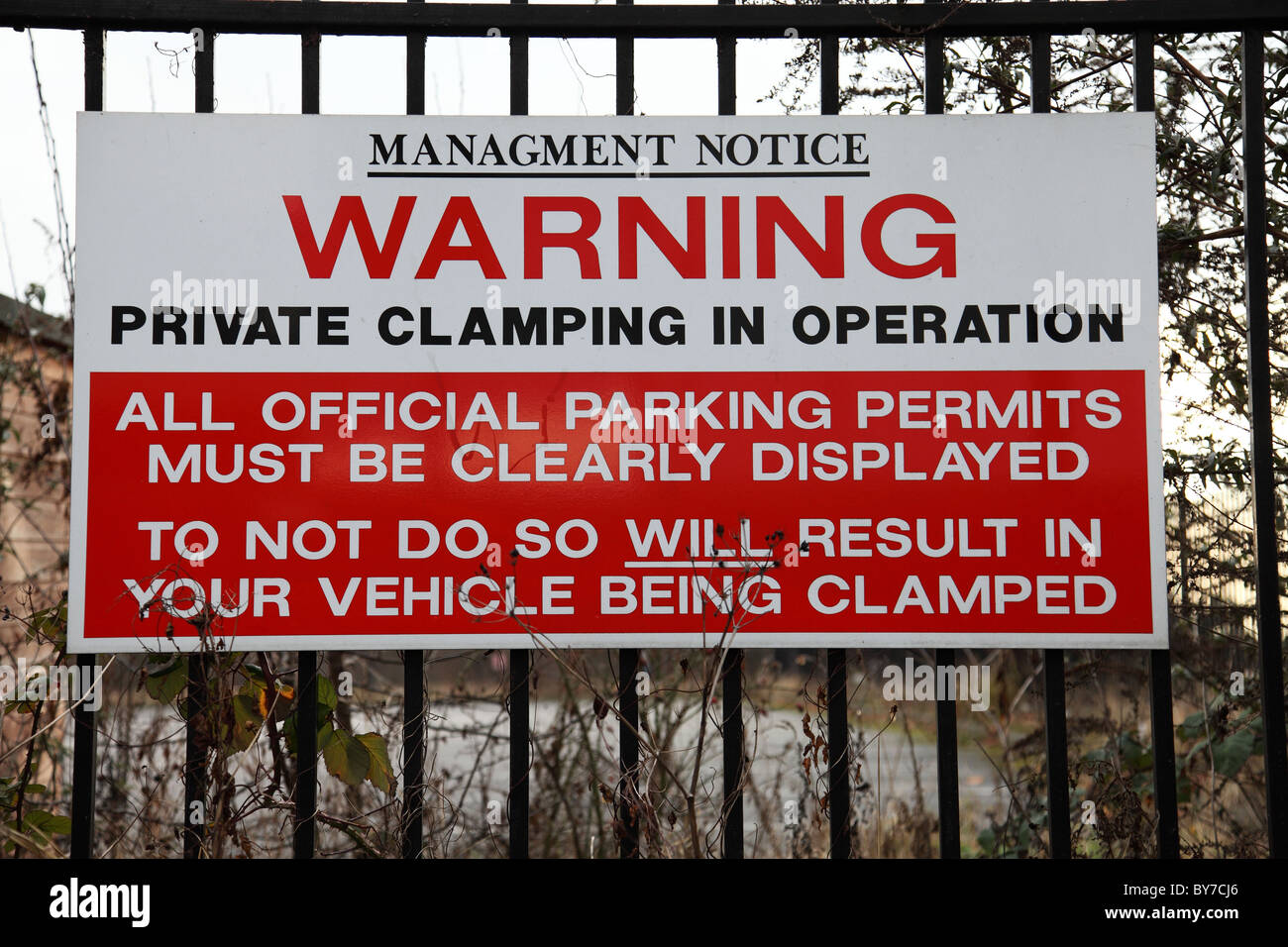 A wheel clamping warning sign in a private car park in a U.K. city