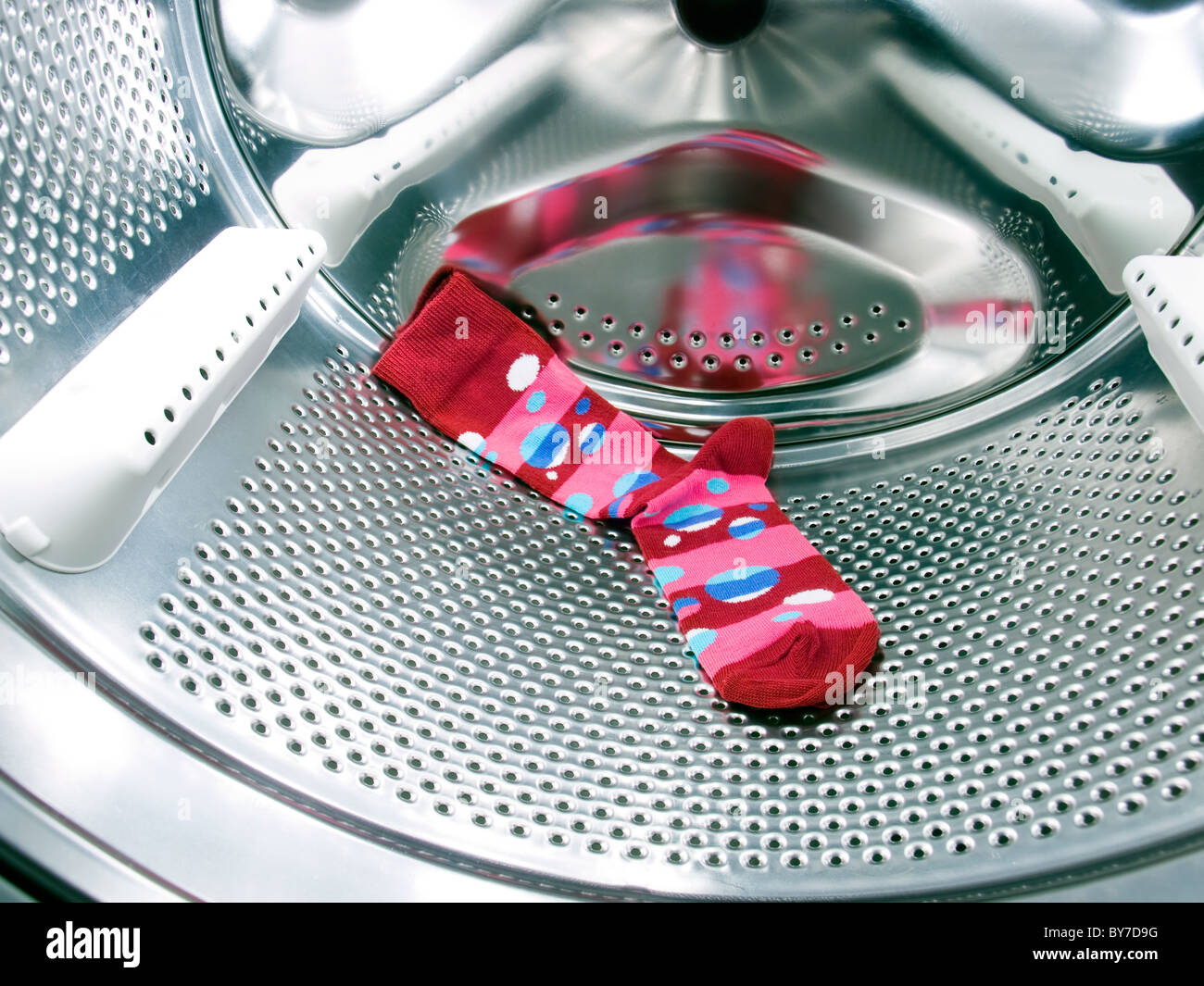 Do not forget the red or colorful sock in a washing machine! Stock ...