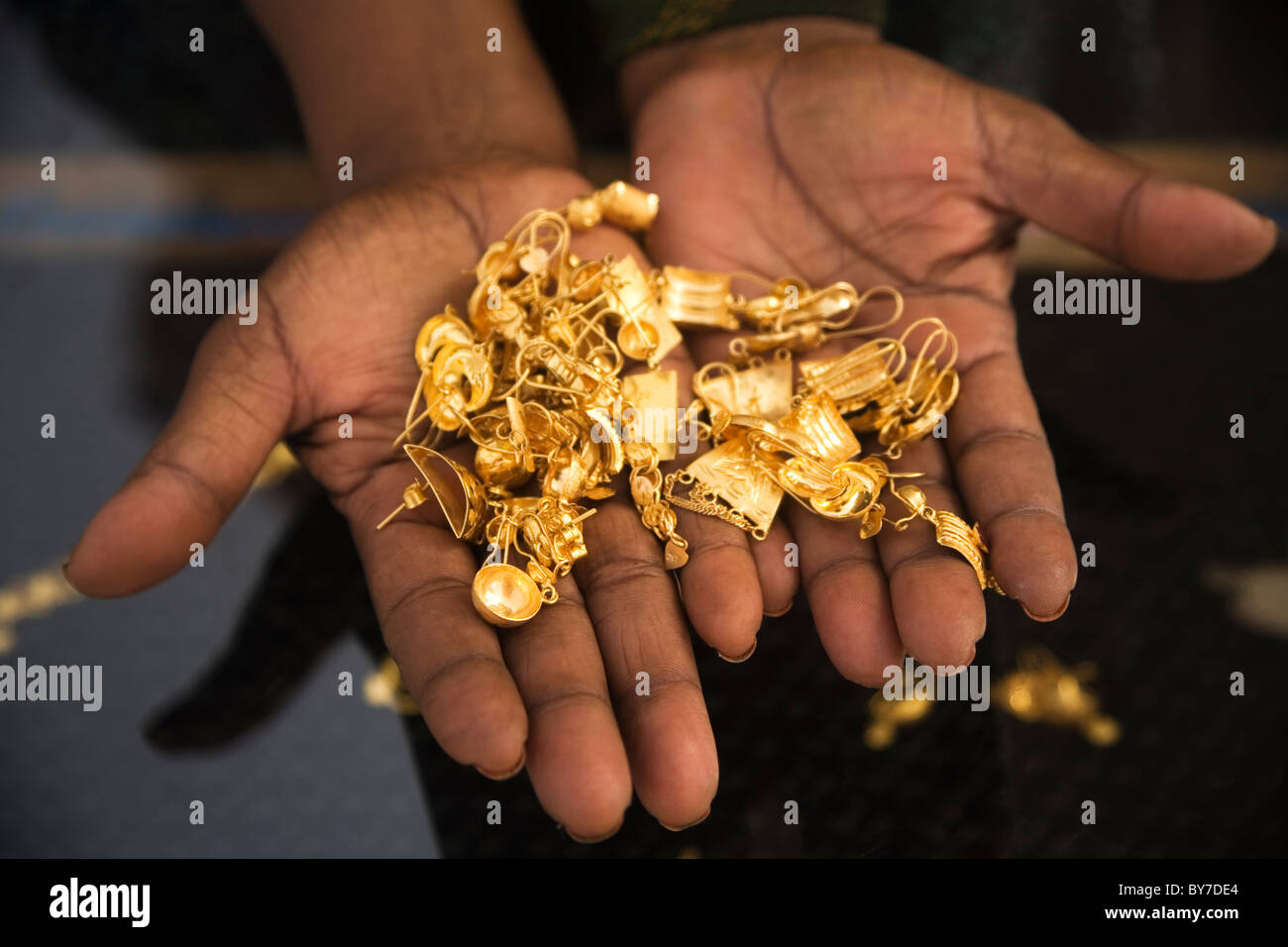 Somali woman trader holds gold jewelery at Hargeysa market, Somaliland, Somalia, Africa Stock Photo