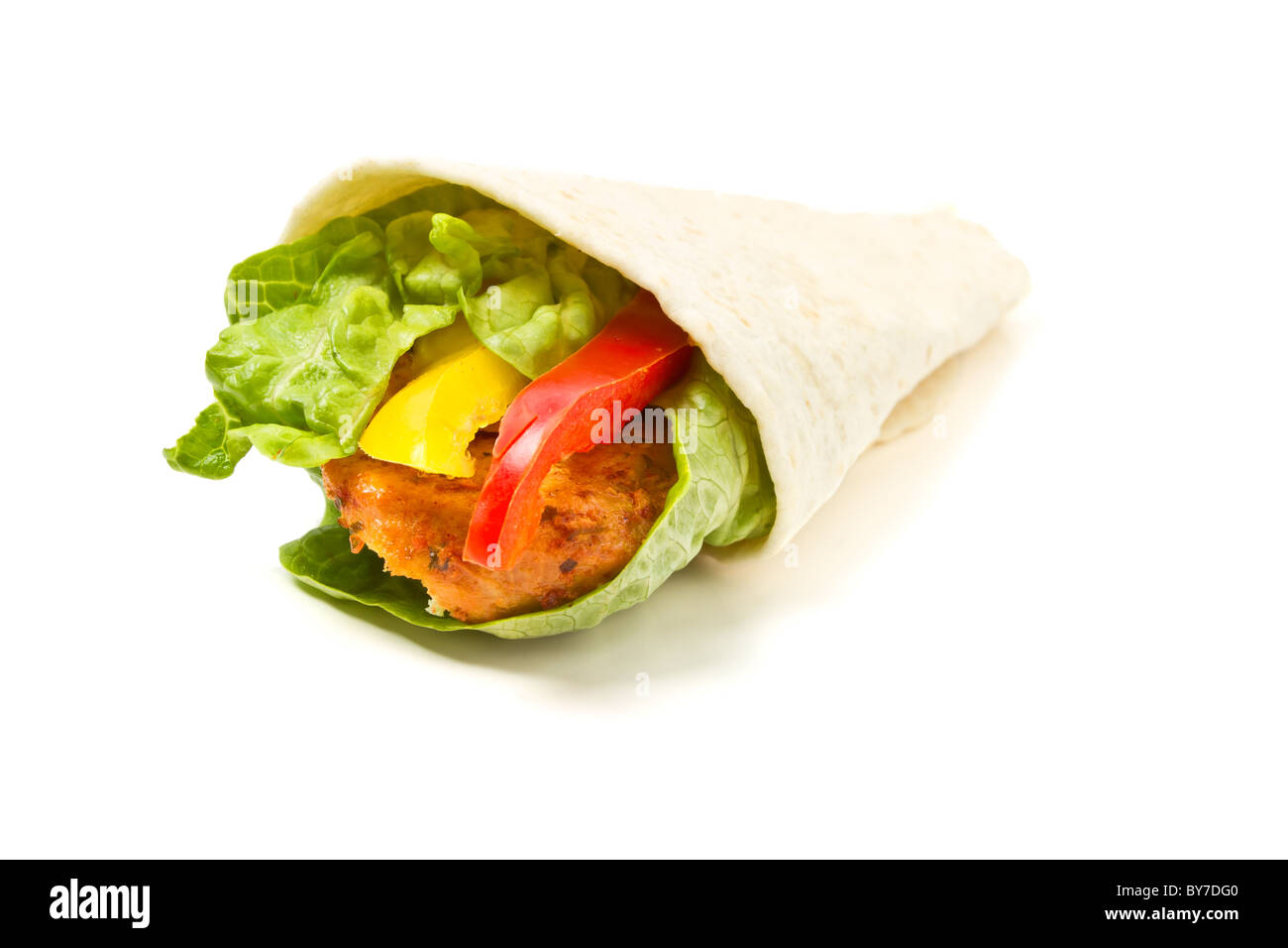 Spicy chicken with salad and salsa wrapped in a soft flour tortilla. Stock Photo