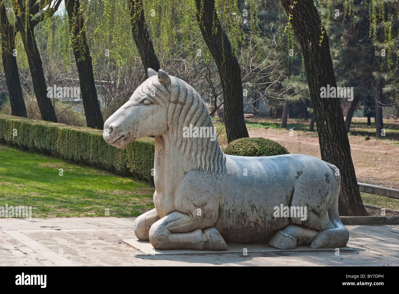 Asia, China, Beijing, Changping. Oversize sculpture of sitting horse; one of 36 figures on the Sacred Way at Ming Tombs. Stock Photo