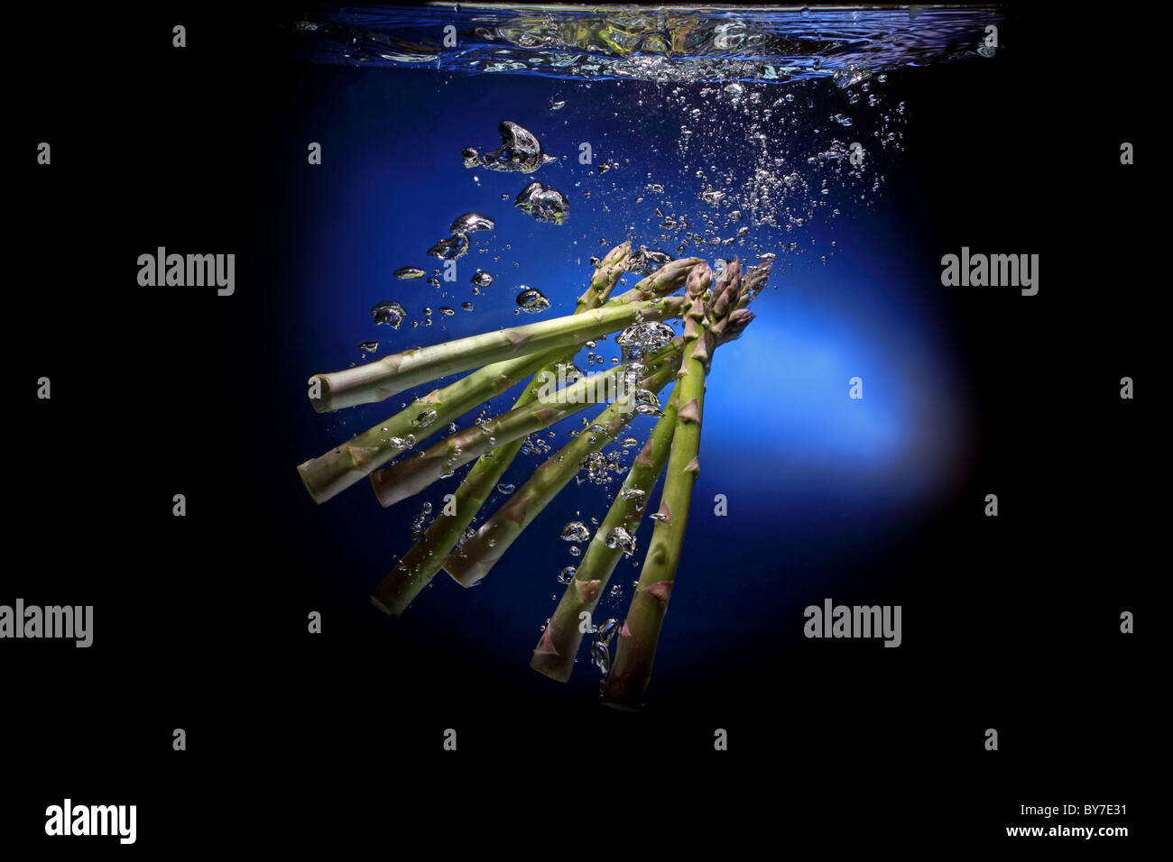 uncooked green asparagus water Stock Photo
