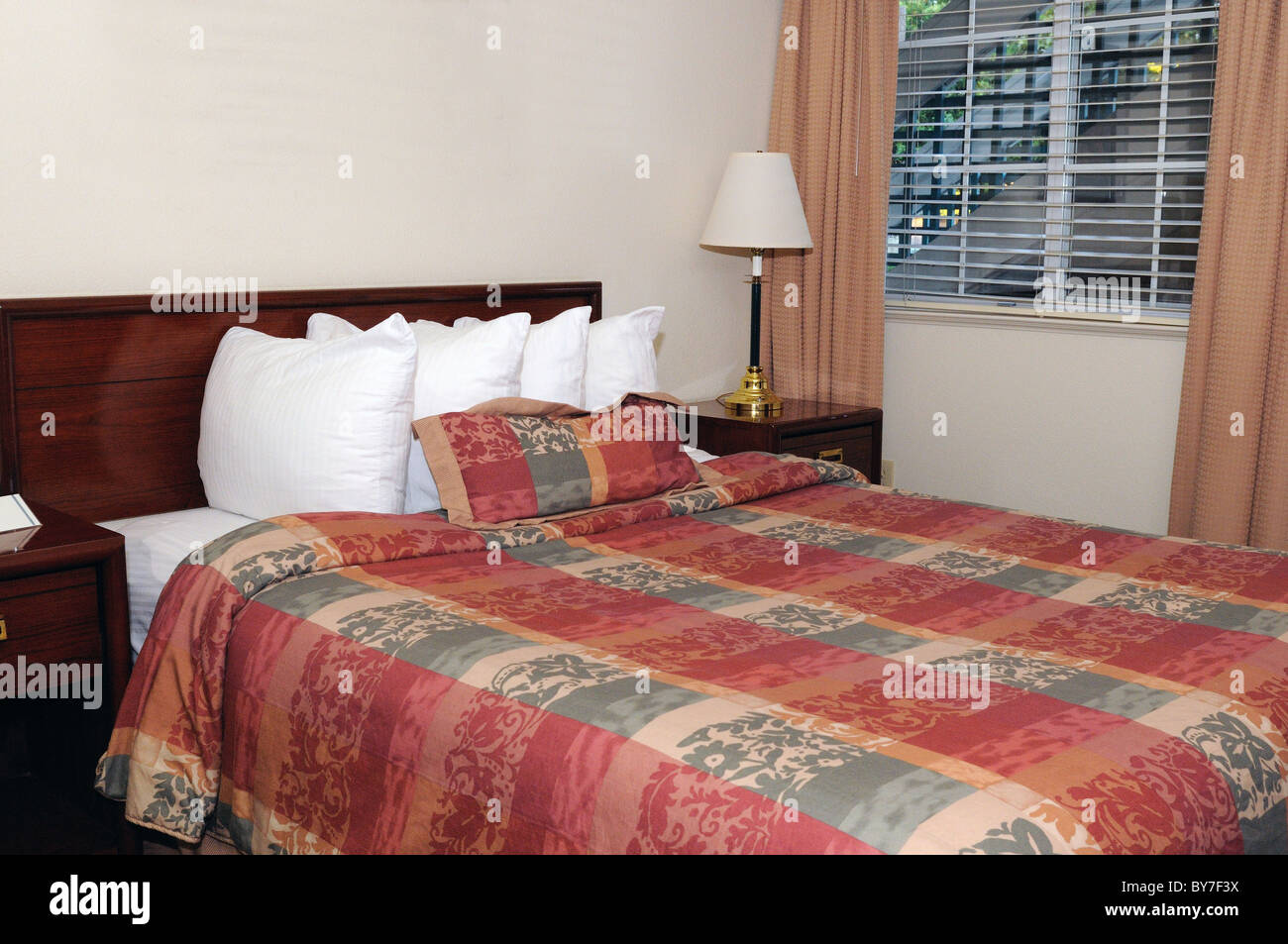 A simple and confortable hotel room with beds Stock Photo