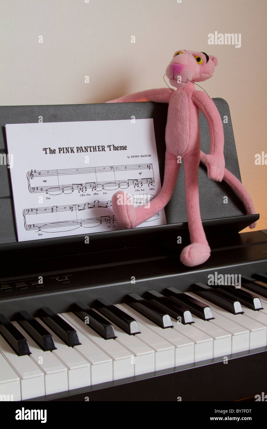 pink panther stay on piano look note of Pink panther theme Stock Photo