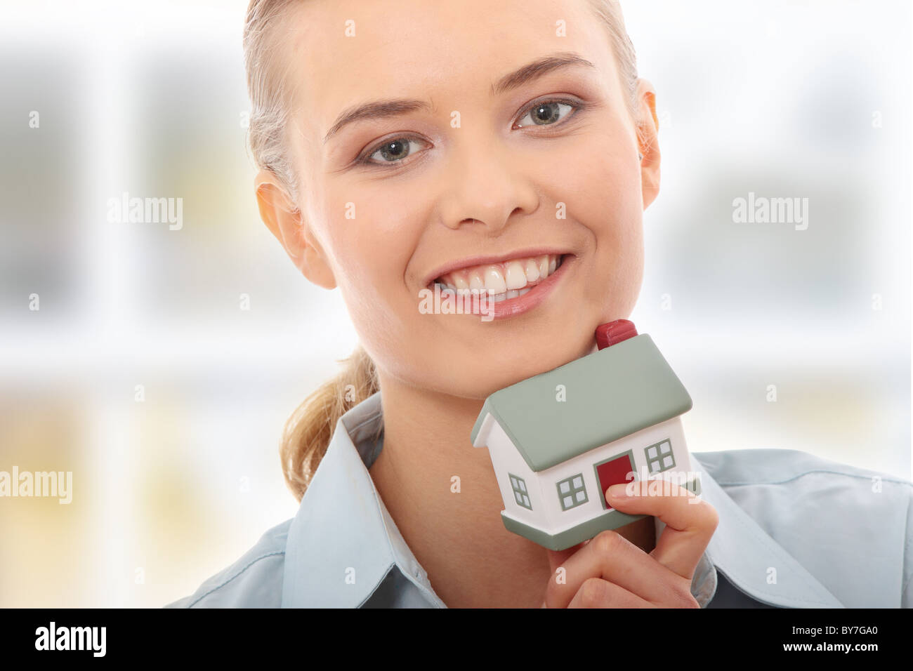 Young beautiful business woman with house model - real estate Stock ...
