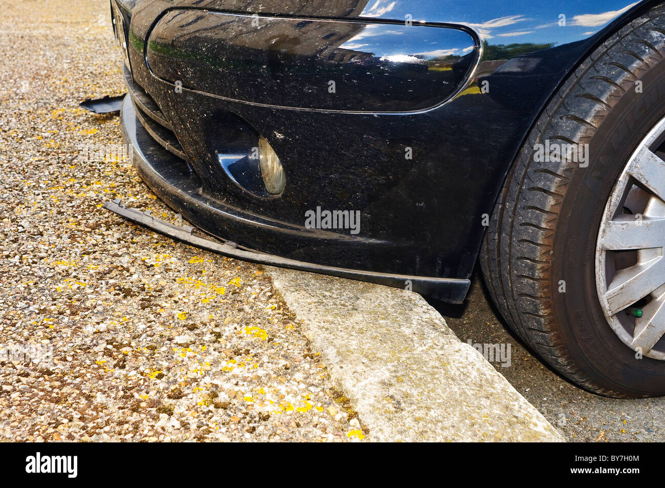 Car over-riding curb damaging front fender – France Stock Photo - Alamy