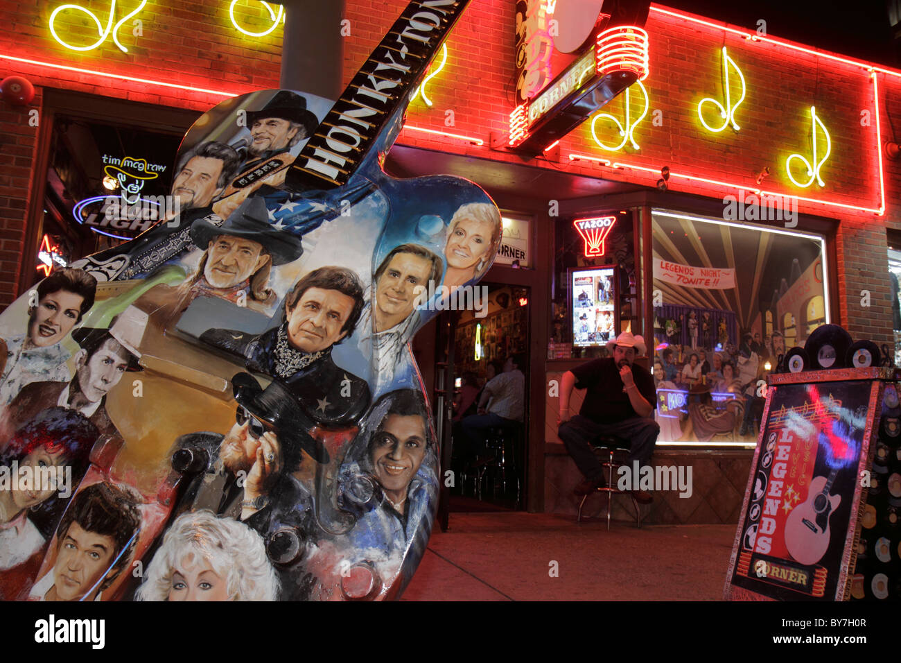 Tennessee Nashville,Music City USA,downtown,Lower Broadway,strip,neon light,sign,honky tonk,street,sidewalk,Legends Corner,country music,GuitarTown Pr Stock Photo