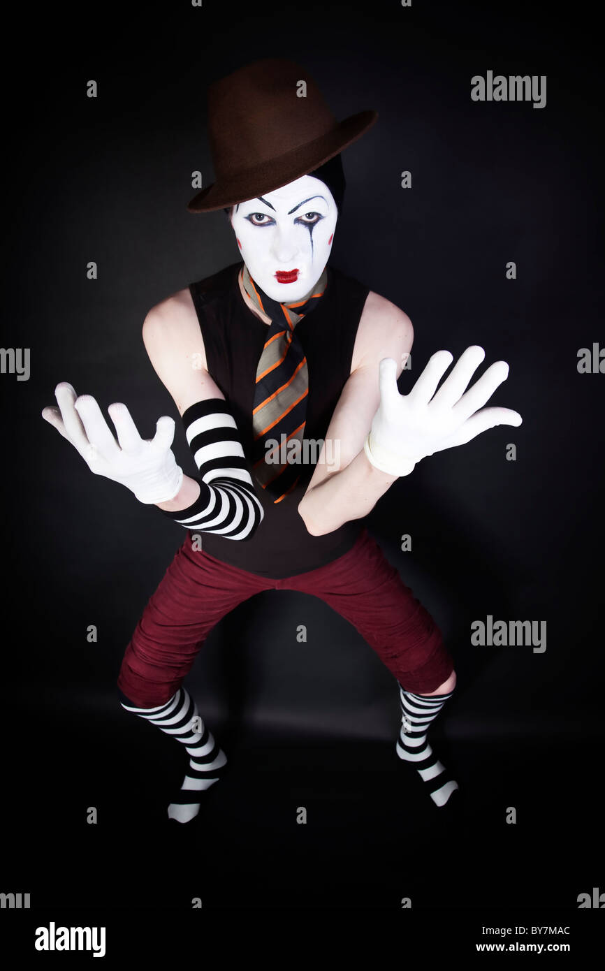 mime in hat, tie and white gloves on black background Stock Photo Alamy
