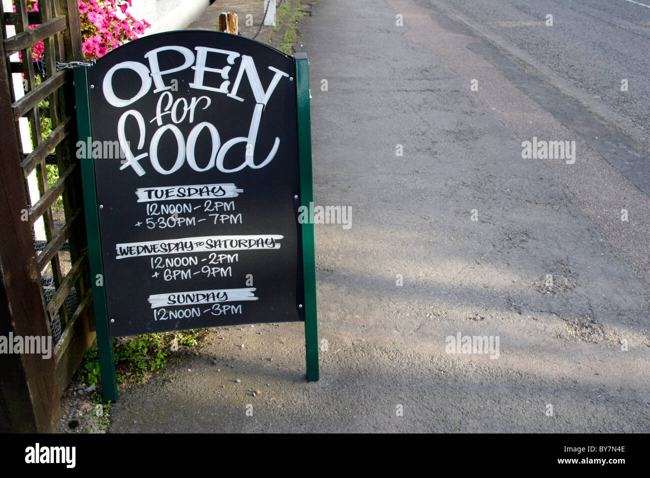 English pub food sign on pavement , England , UK Stock Photo