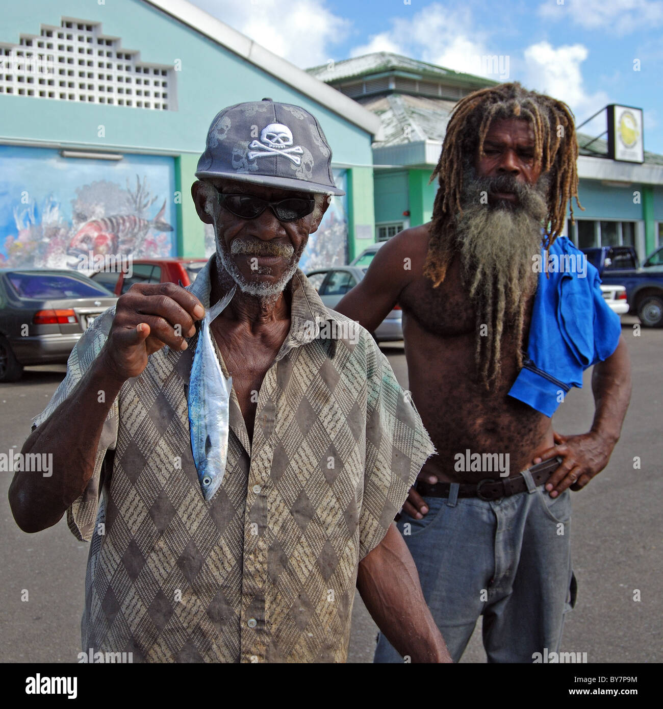 Local man holding a fish, Castries, St. Lucia, Caribbean. Stock Photo